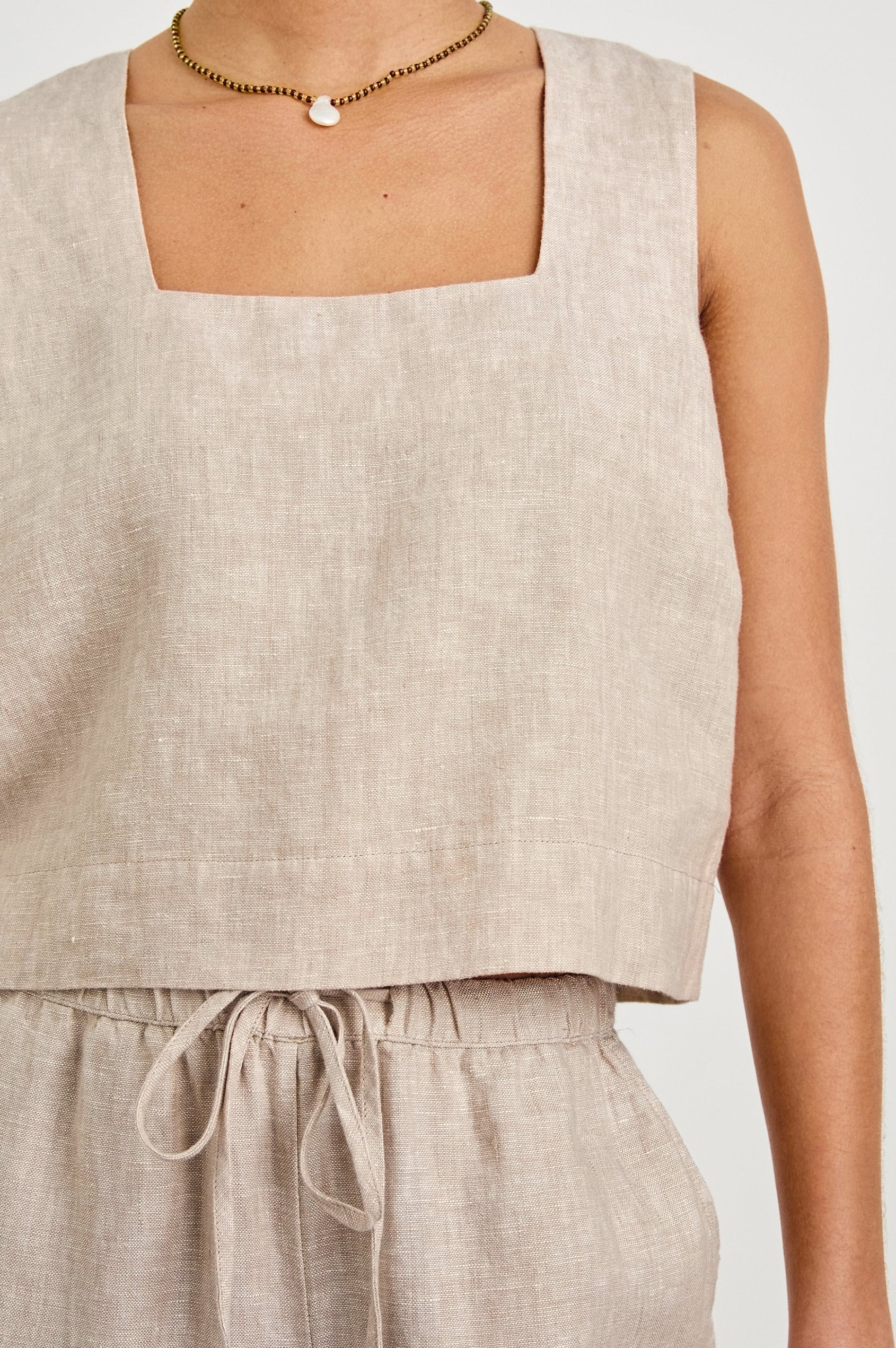 Akira relaxed fit linen crop top with wide straps in Heathered Flax - close up of details on model