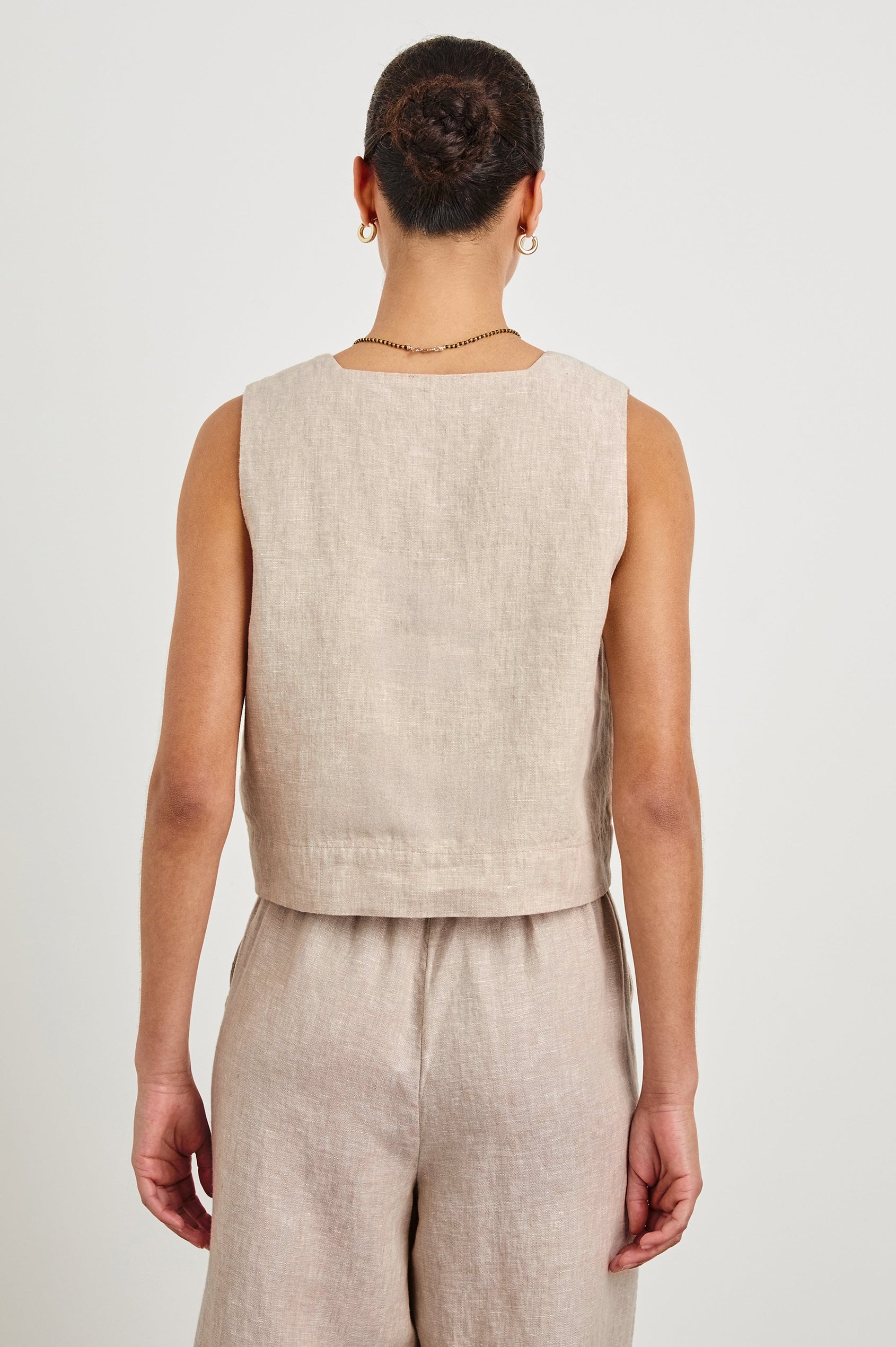 Akira relaxed fit linen crop top with wide straps in Heathered Flax - back view on model
