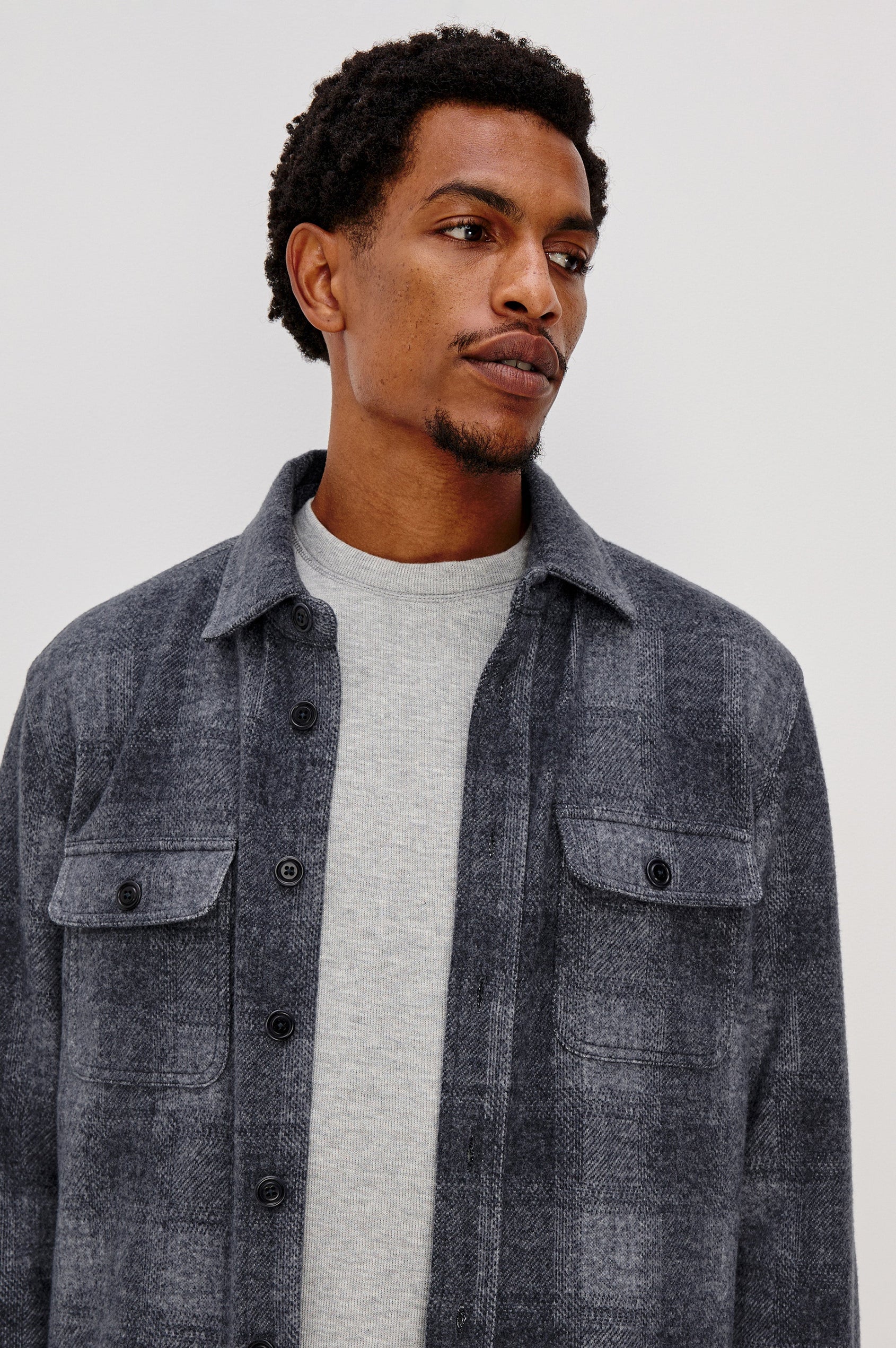 Alder Long-Sleeve Button up with Two Buttoned Chest Flap Pockets in Dusk Eclipse Colorway, a plaid - Front Unbuttoned Detailed View Featured on Model