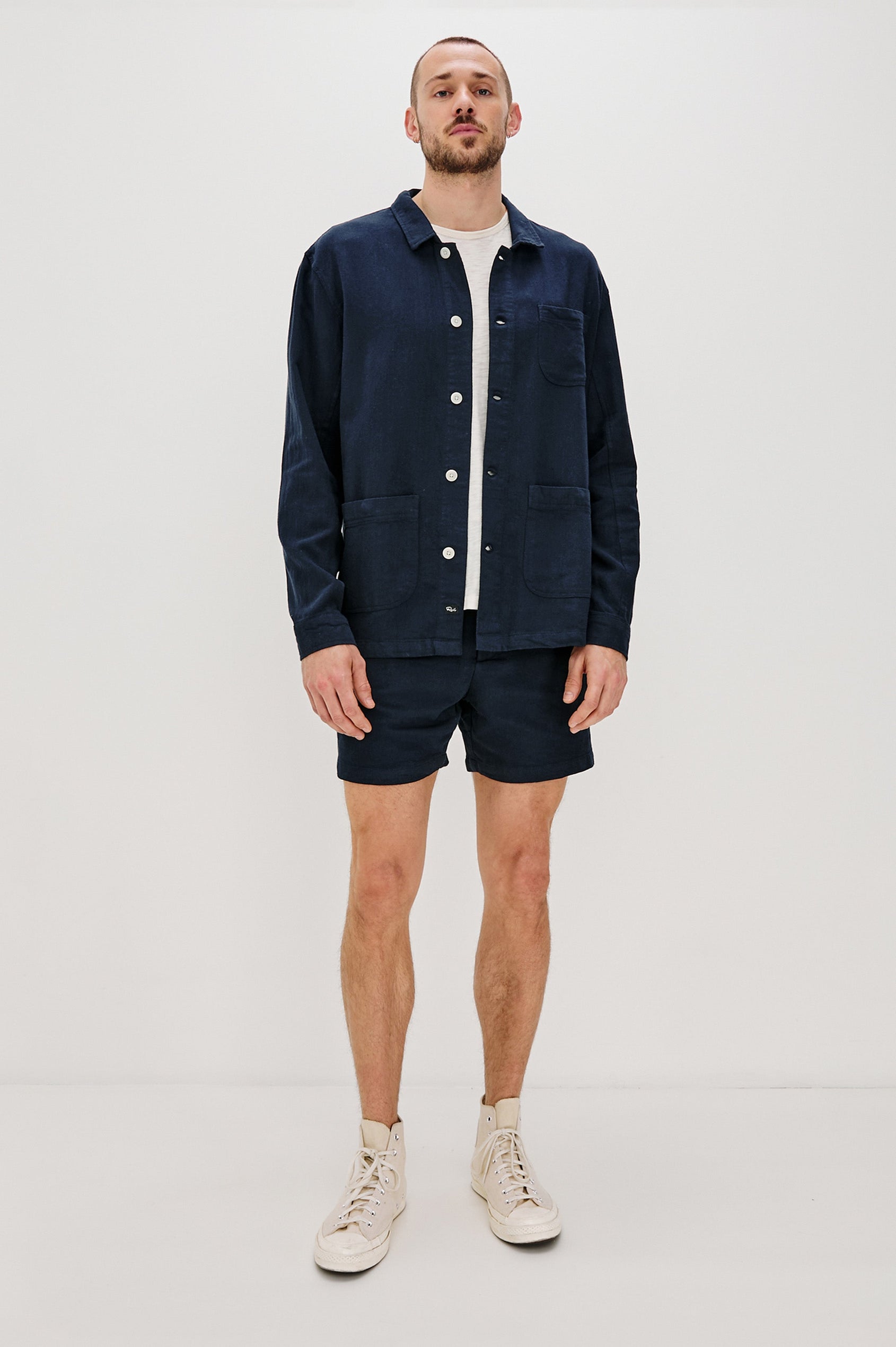 Ambrose Jacket with Button Closure and Two Front Patch Pockets and a Chest Patch Pocket in Deep Meridian Colorway - Front Full Body View Featured on Model