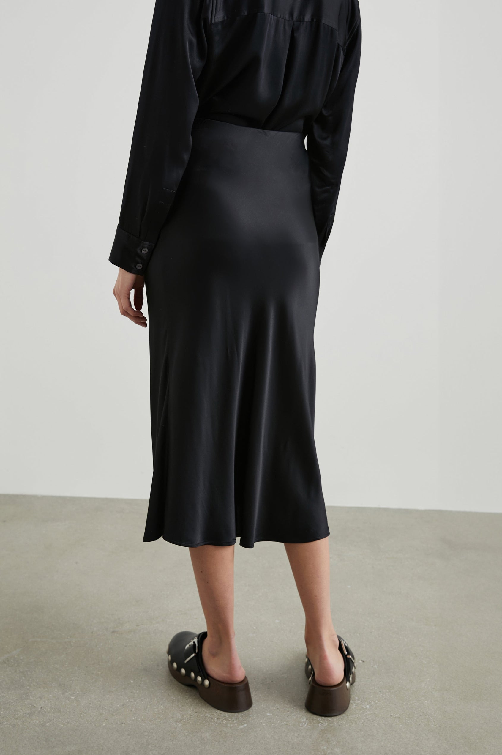 Berlin Midi Skirt in Black Colorway - Back View Featured on Model