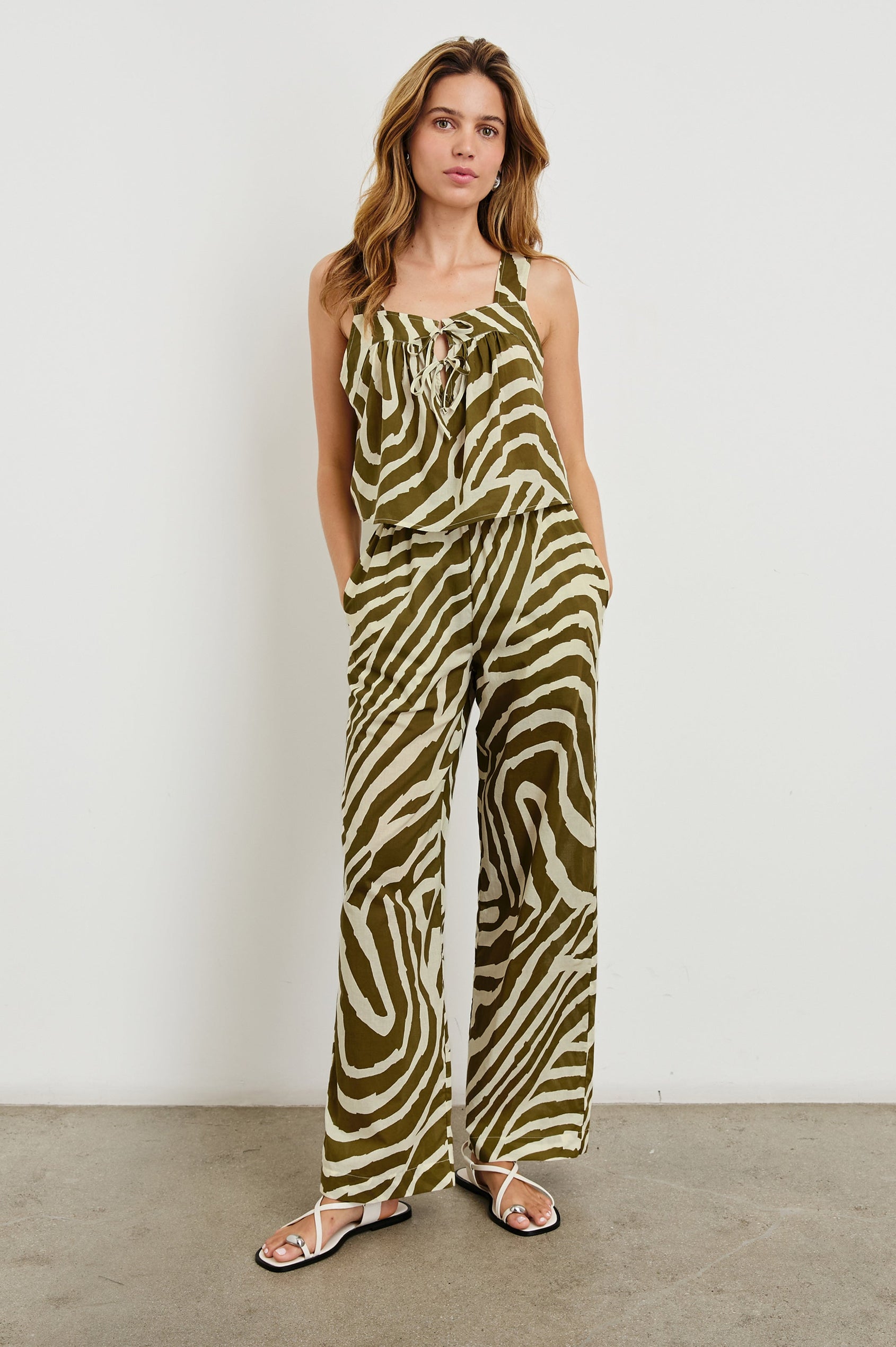 Blythe Crop Tank Top with a Deep Neck with Ties in Selva Colorway, an Olive and White Print - Front Full Body View Featured on Model