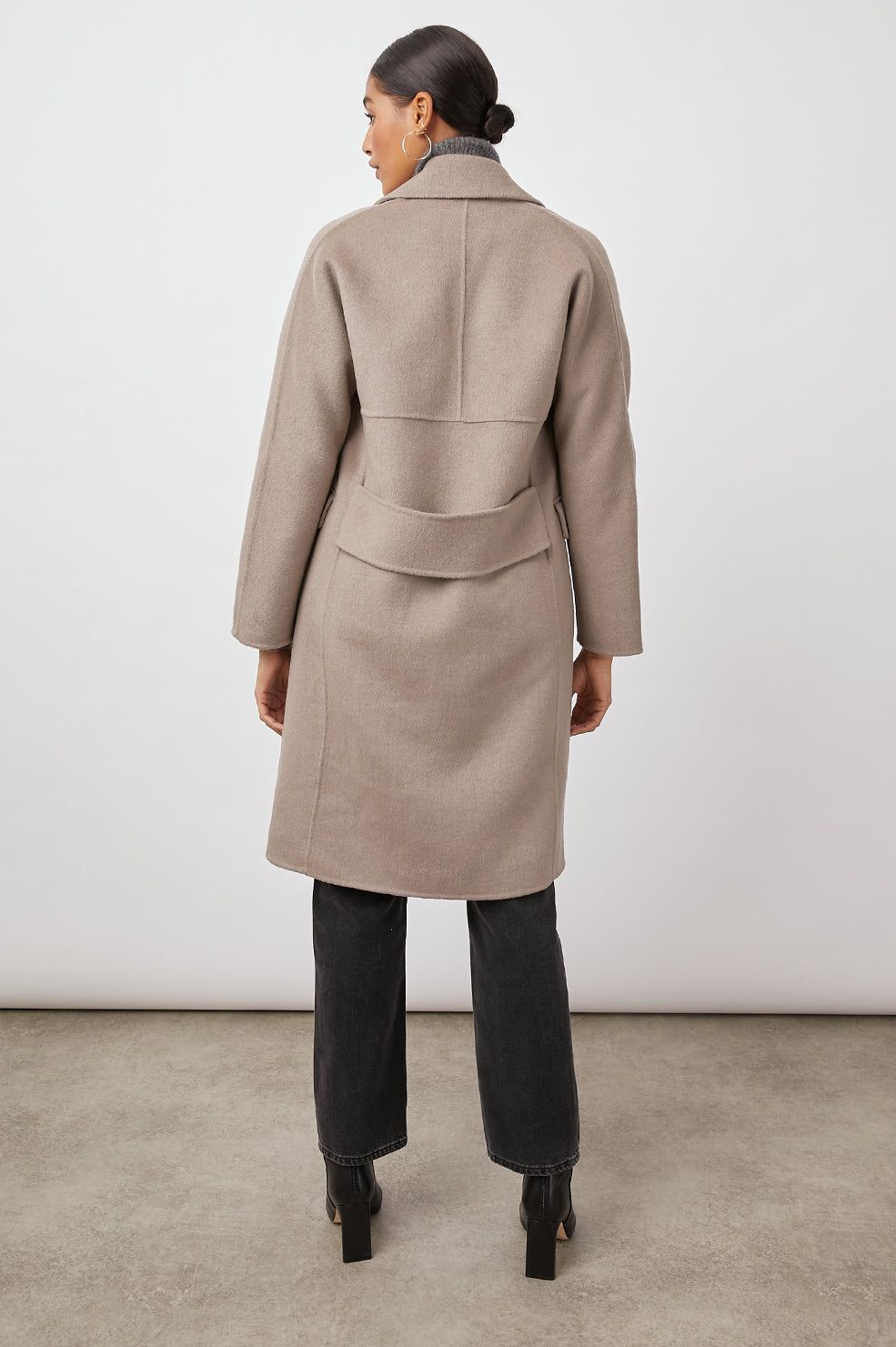 Bristol Knee-Length Double Breasted Coat with Two-Button Closure, Notched Lapels, Two Front Flap Pockets, Center Back Seams, and a Belted Back in Mink Colorway, a Light Brown - Back Full View Featured on Model