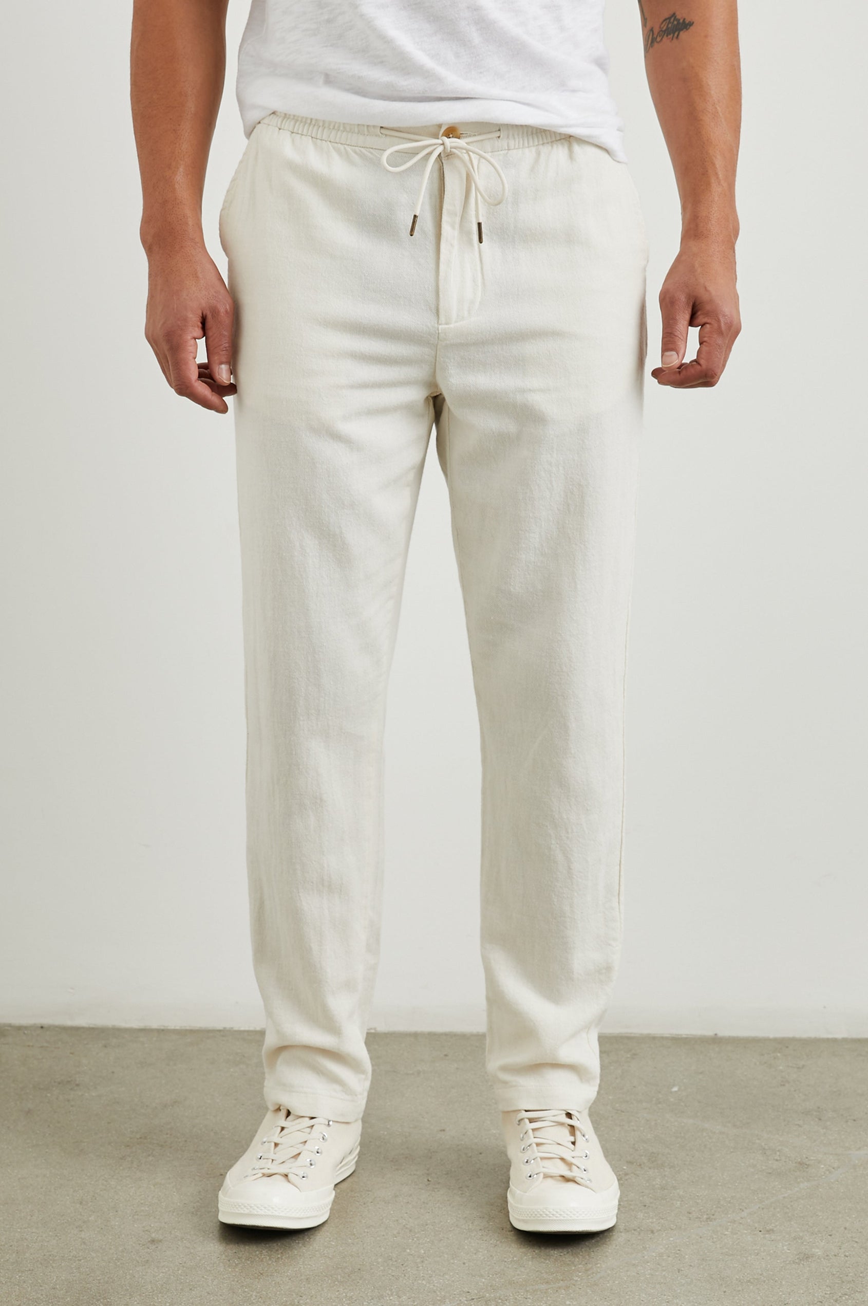 Callum Pants with a Drawstring Waist, Two Front Pockets and a Back Patch Pocket in Ecru Colorway - Front View Featured on Model