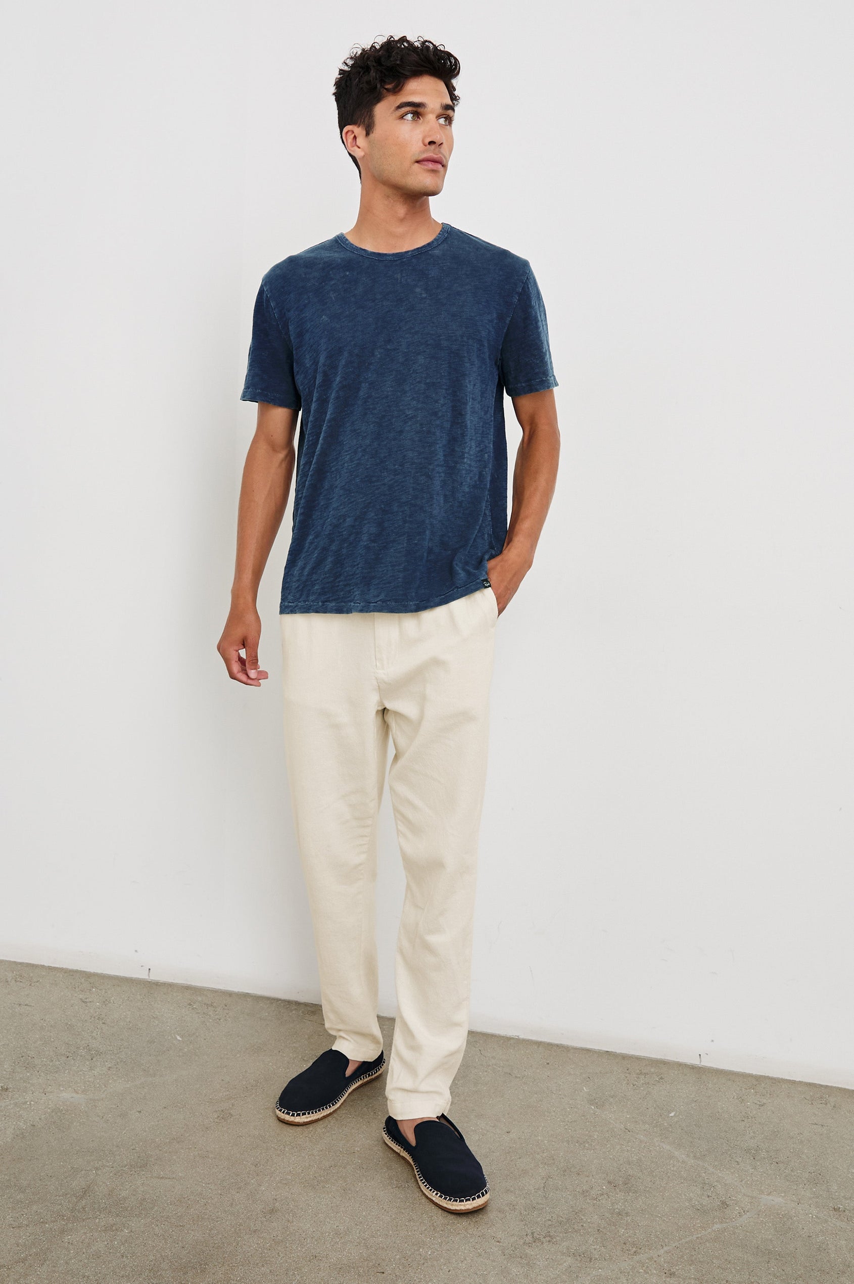 Callum extended length linen straight leg pant with elastic waistband and adjustable drawstring in Ecru - full body front view on model