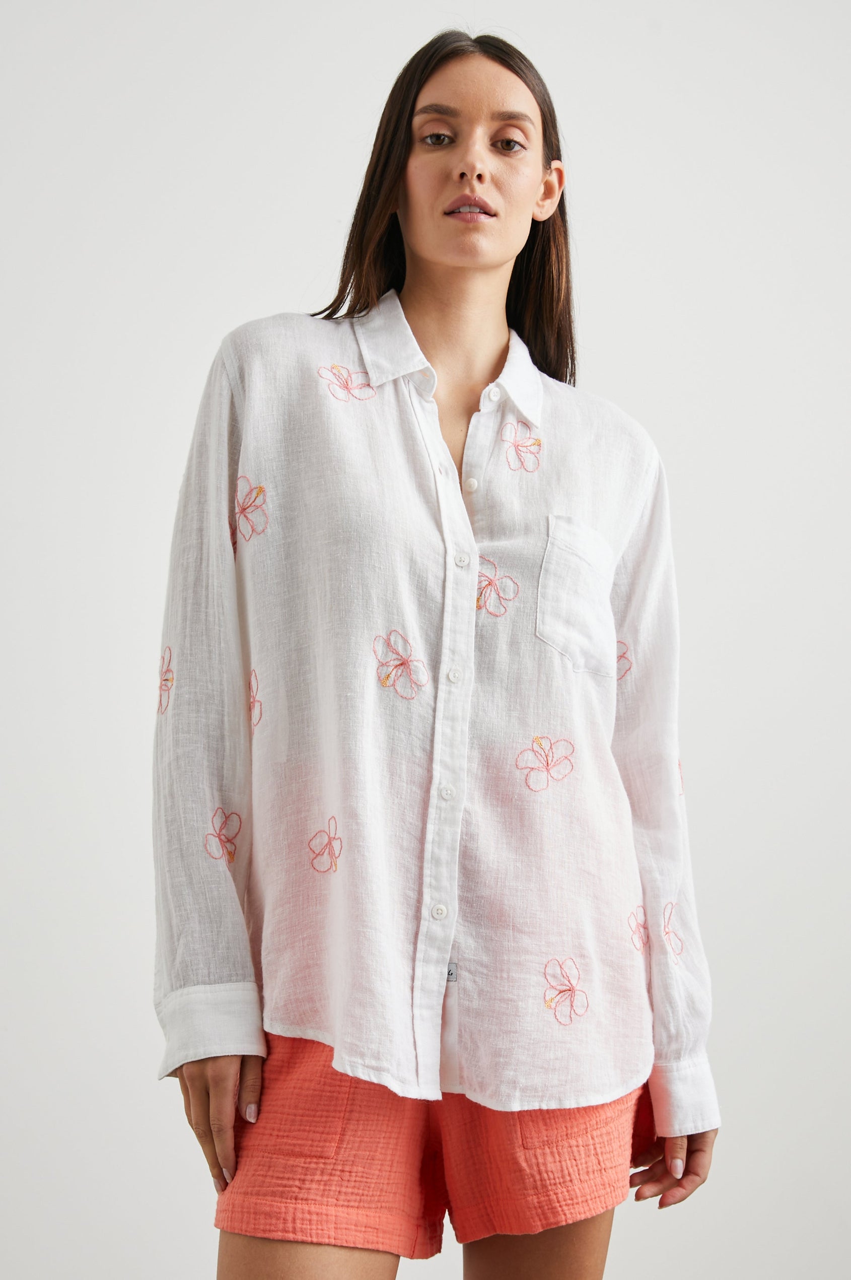 Charli Long-Sleeve Button up with a Chest Patch Pocket in Hibiscus Embroidery Colorway, with Hibiscus on white - Front View Featured on Model
