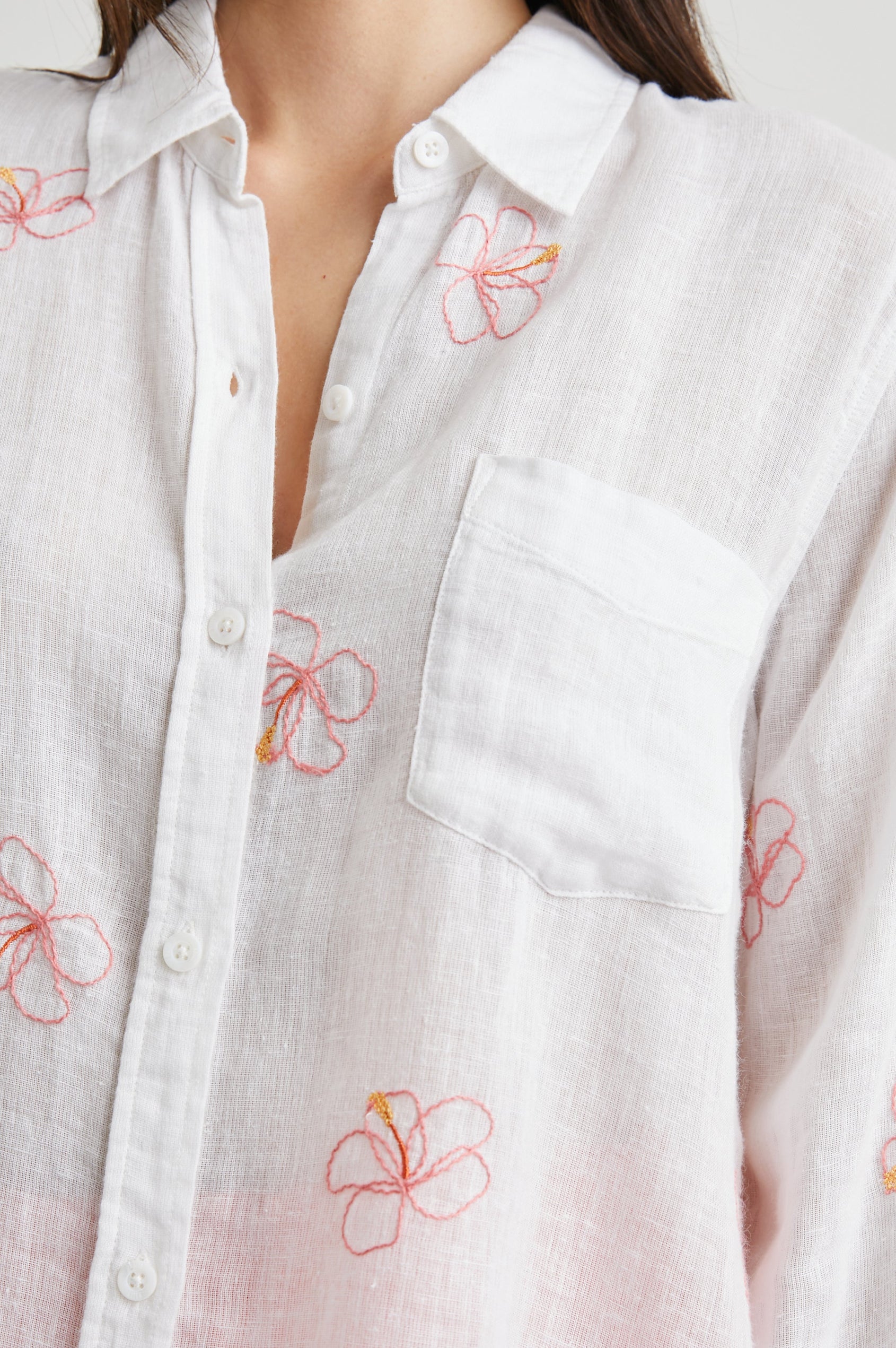 Charli Long-Sleeve Button up with a Chest Patch Pocket in Hibiscus Embroidery Colorway, with Hibiscus on white - Front View Featured on Model
