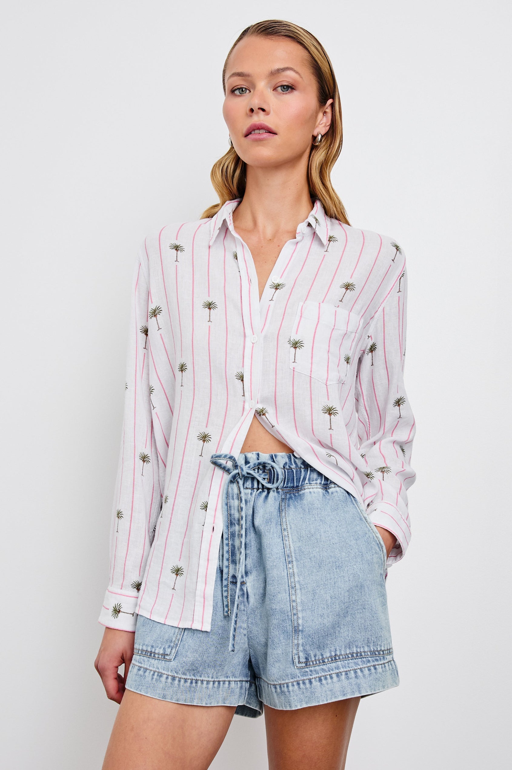 Charli Long-Sleeve Button up with a Chest Patch Pocket in Pink Palm Colorway, with pink vertical stripes dashed with palm trees on ivory - Front View Featured on Model