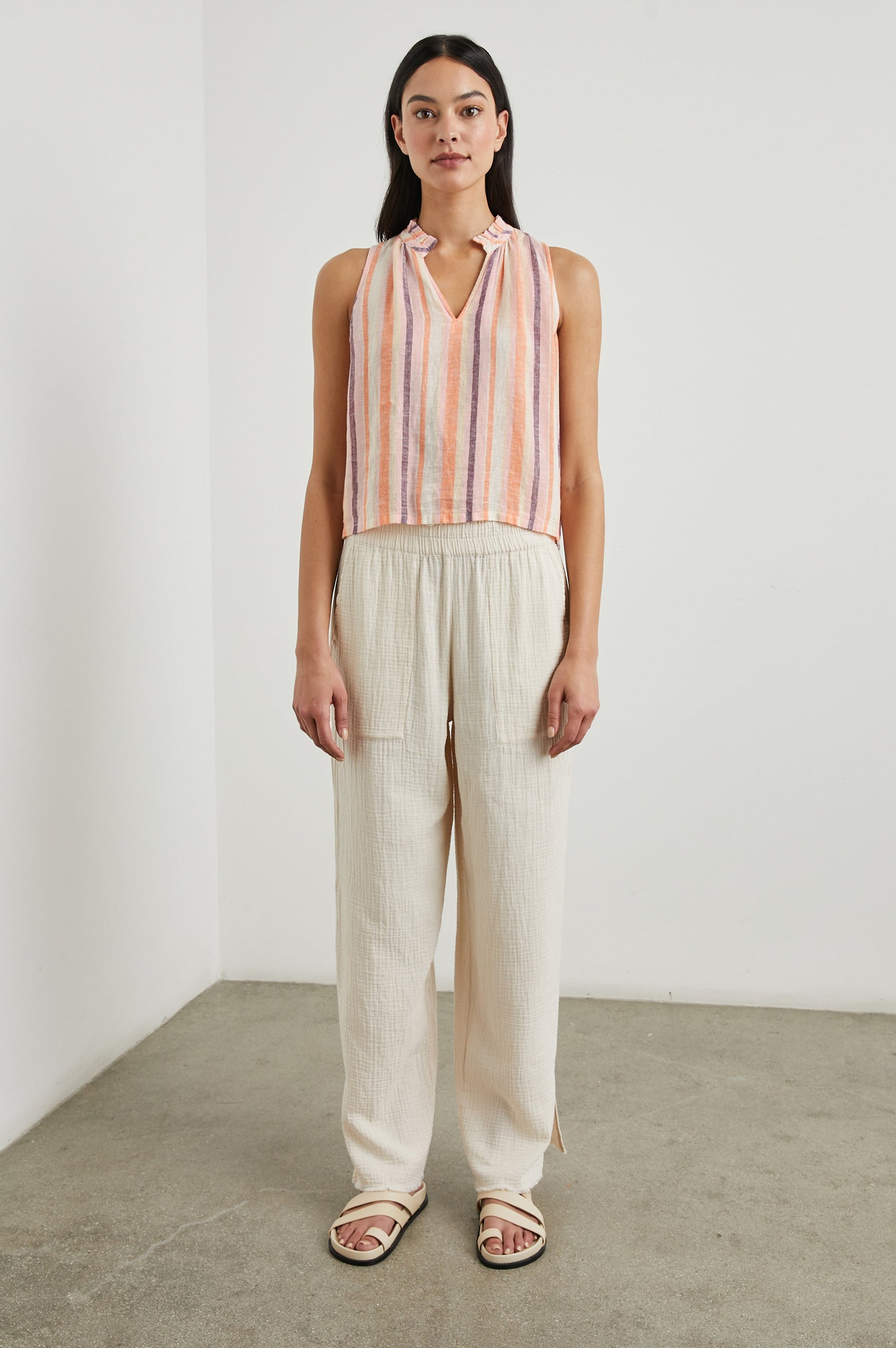 Christy Sleeveless Tank Top, with a V Neck and a Ruched Collar in Papaya Stripe Colorway, Vertical Stripes in Orange, Pink, Purple and Cream - Front Full Body View Featured on Model