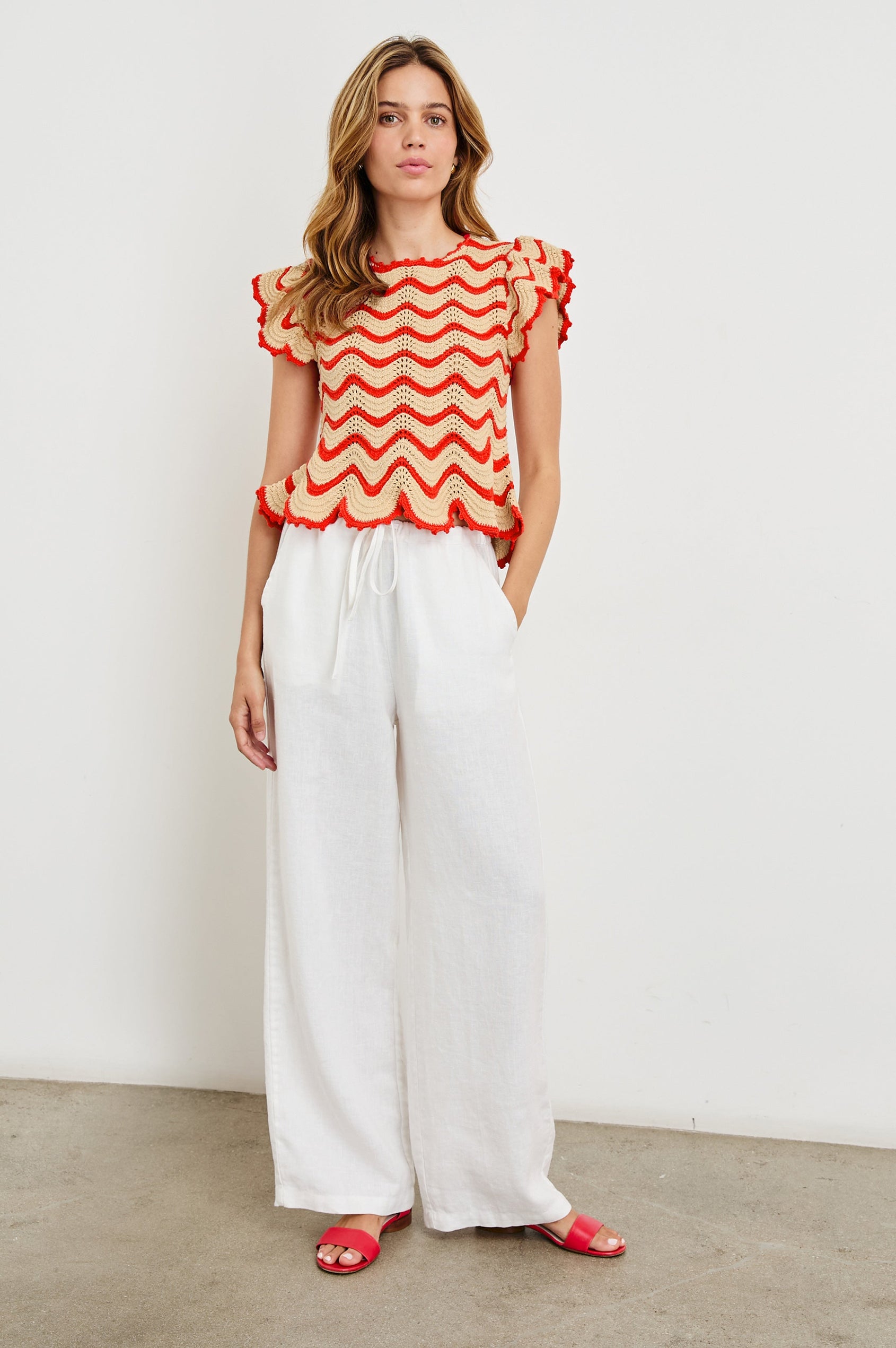 Coen Crochet Knit Short-Sleeve Top with Flared Sleeves and a Back Keyhole Tie in Cherry Oat Stripe Colorway, Horizontal Wavy Stripes - Front Full Body View Featured on Model