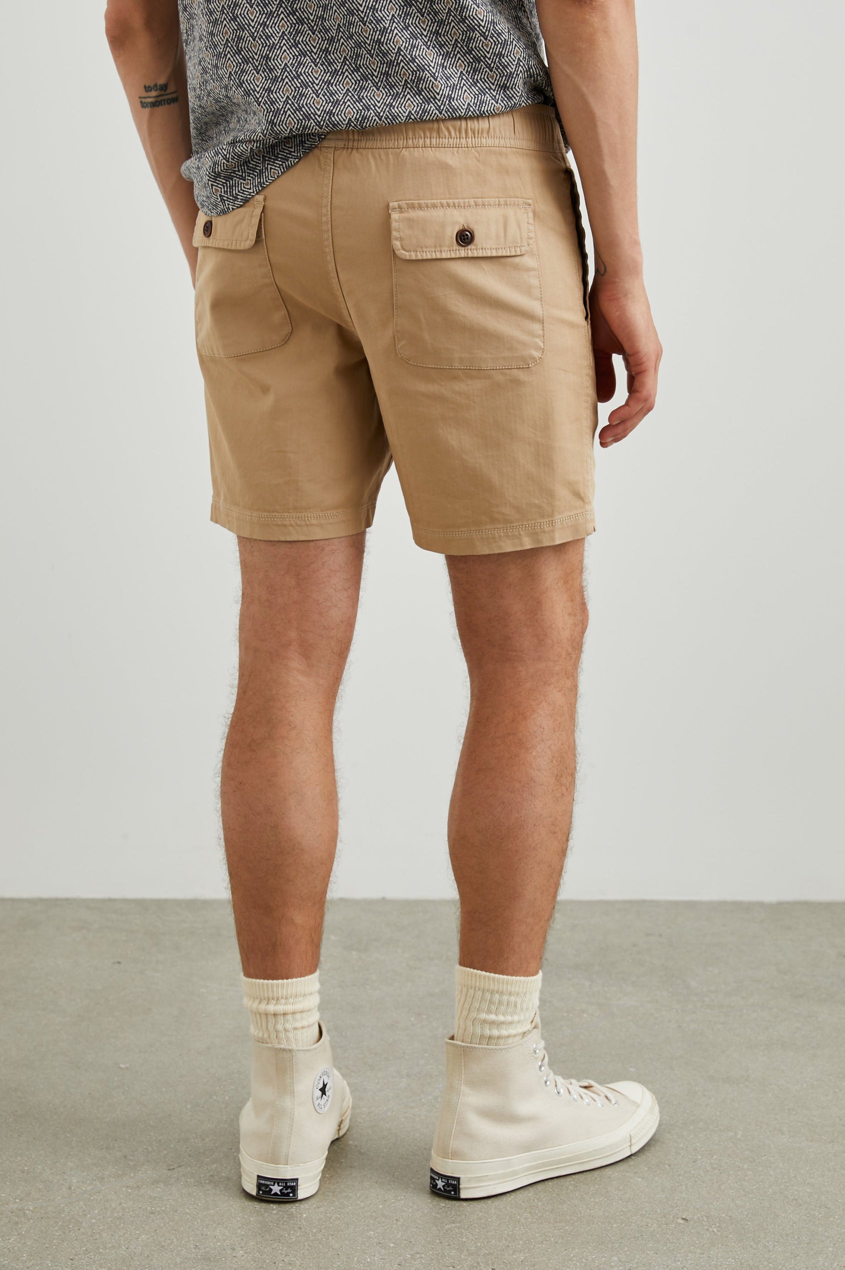 Cruz Shorts with a Drawstring Waist, Two Front Pockets, Two Back Button Flap Pockets in Khaki Colorway - Back View Featured on Model