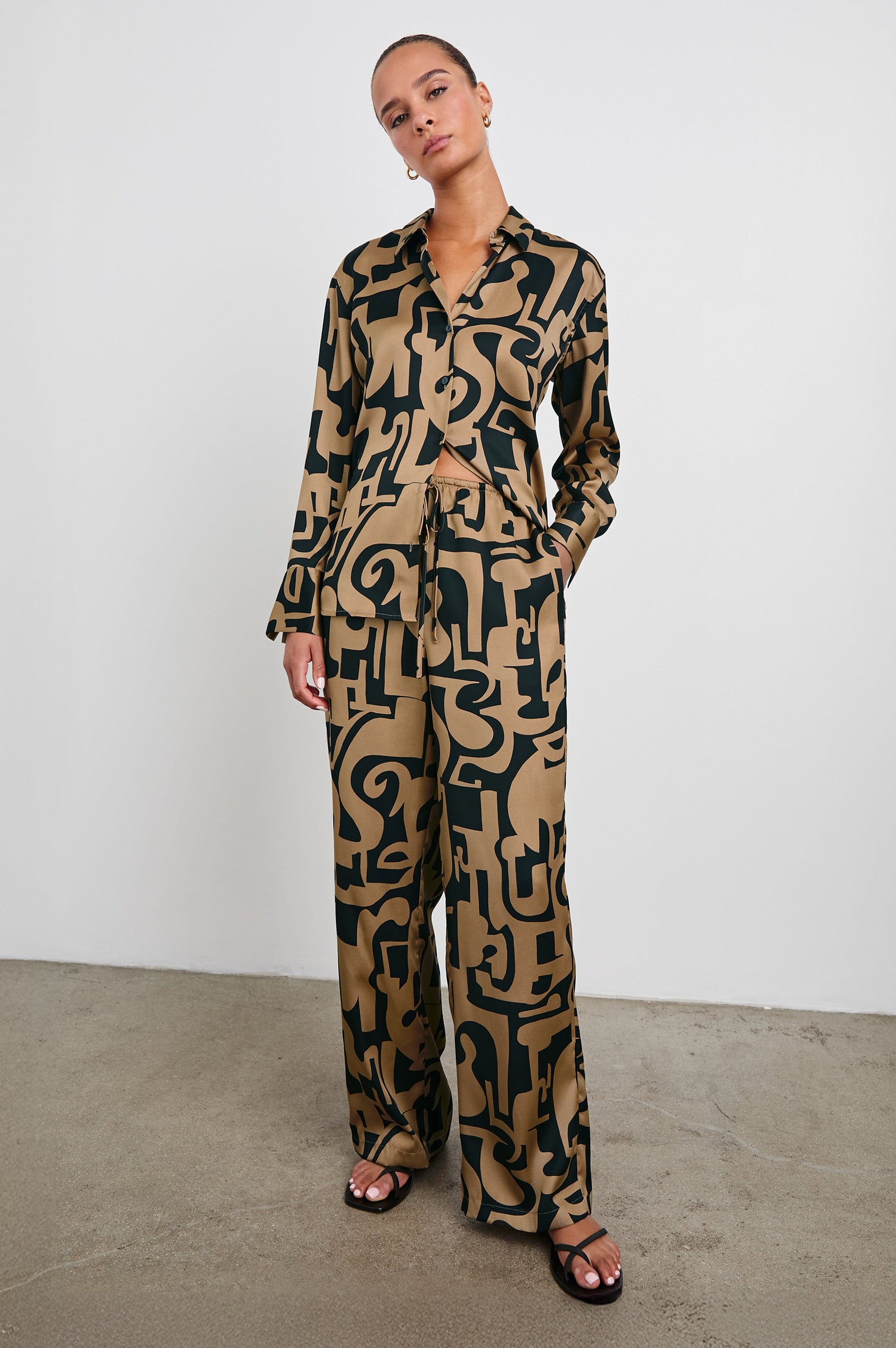 Damini Pants with a Drawstring Waist and Two Front Pockets in Santorini Sand Colorway, a Sand and Black pattern - Front Full Body View Featured on Model