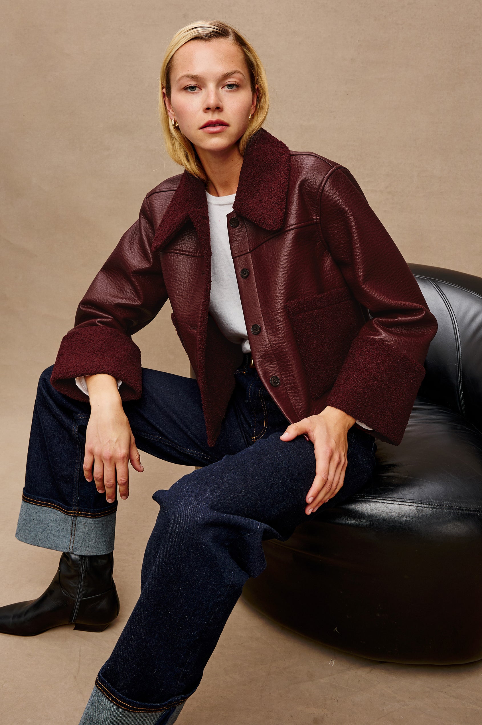 Dria Jacket with Button Closure, Two Front Patch Pockets and Faux Shearling at the Pockets, Cuffs, Collar and Opening in Maroon Shearling Colorway, Front View Featured on Model
