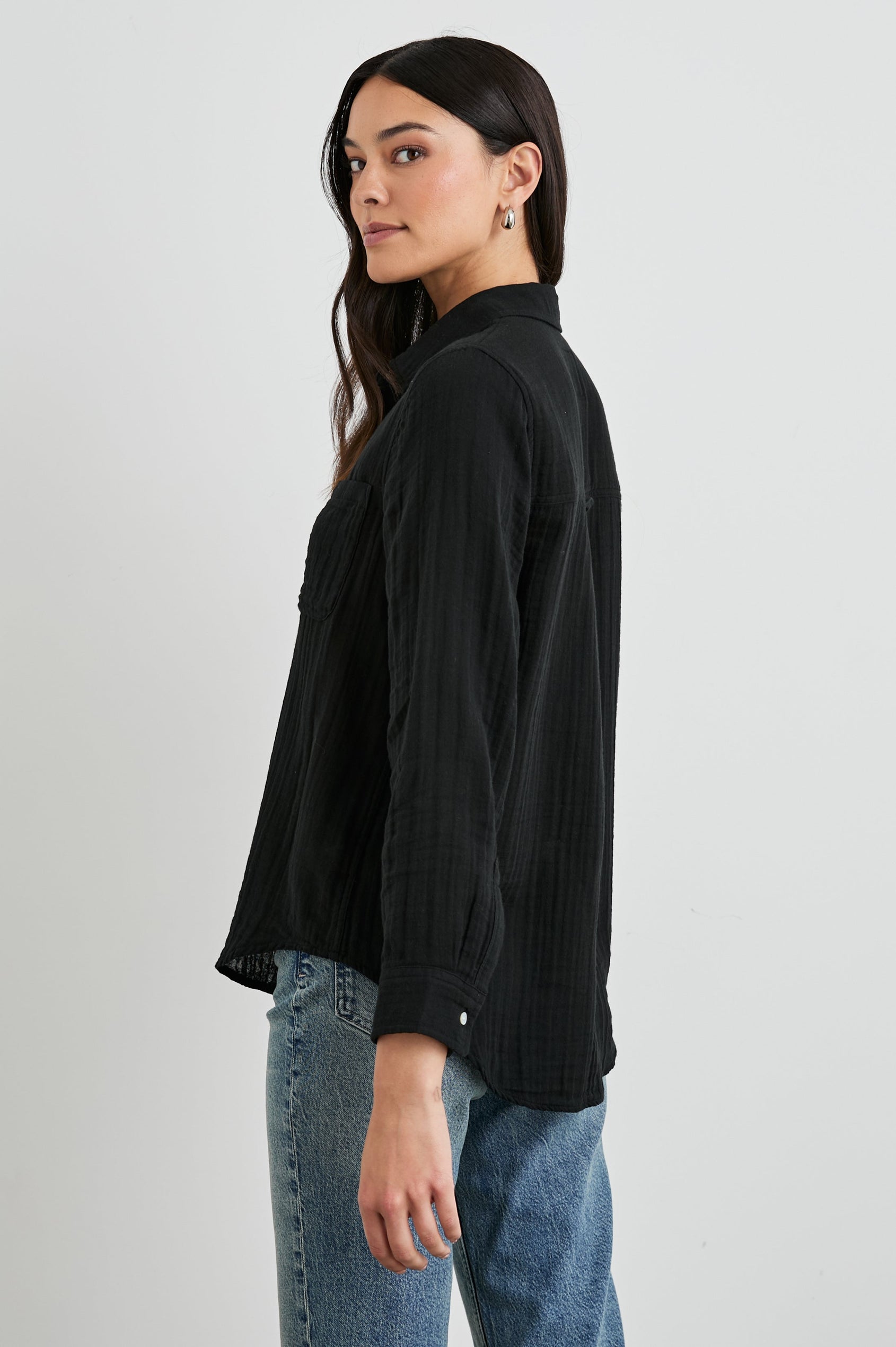 Ellis Long-Sleeve Button Down with Cuffs and a Front Chest Pocket in Black Colorway - Back Untucked View Featured on Model