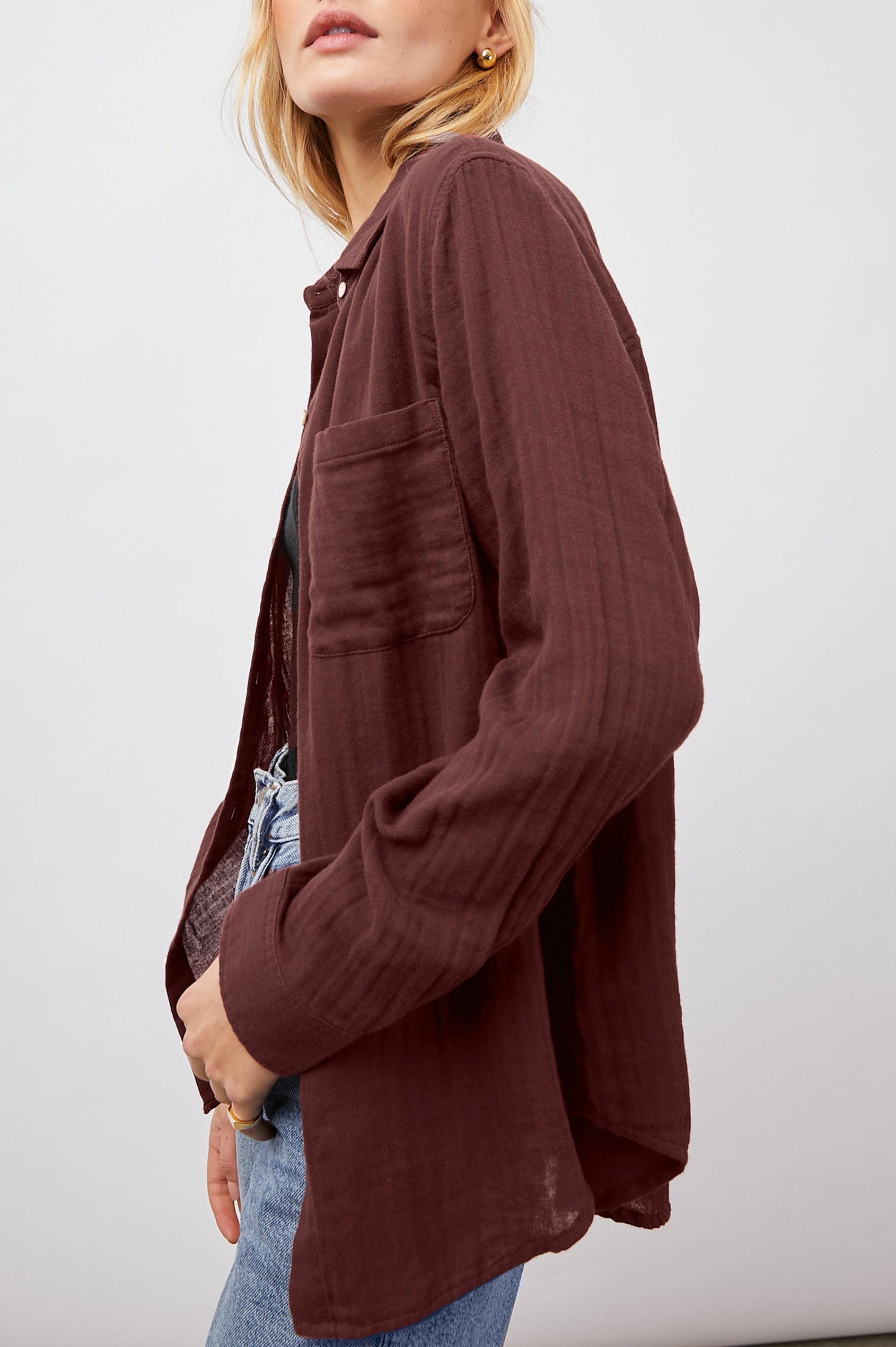 Ellis Long-Sleeve Button Down with Cuffs and a Patch Chest Pocket in Russet Colorway - Side Unbuttoned View Featured on Model