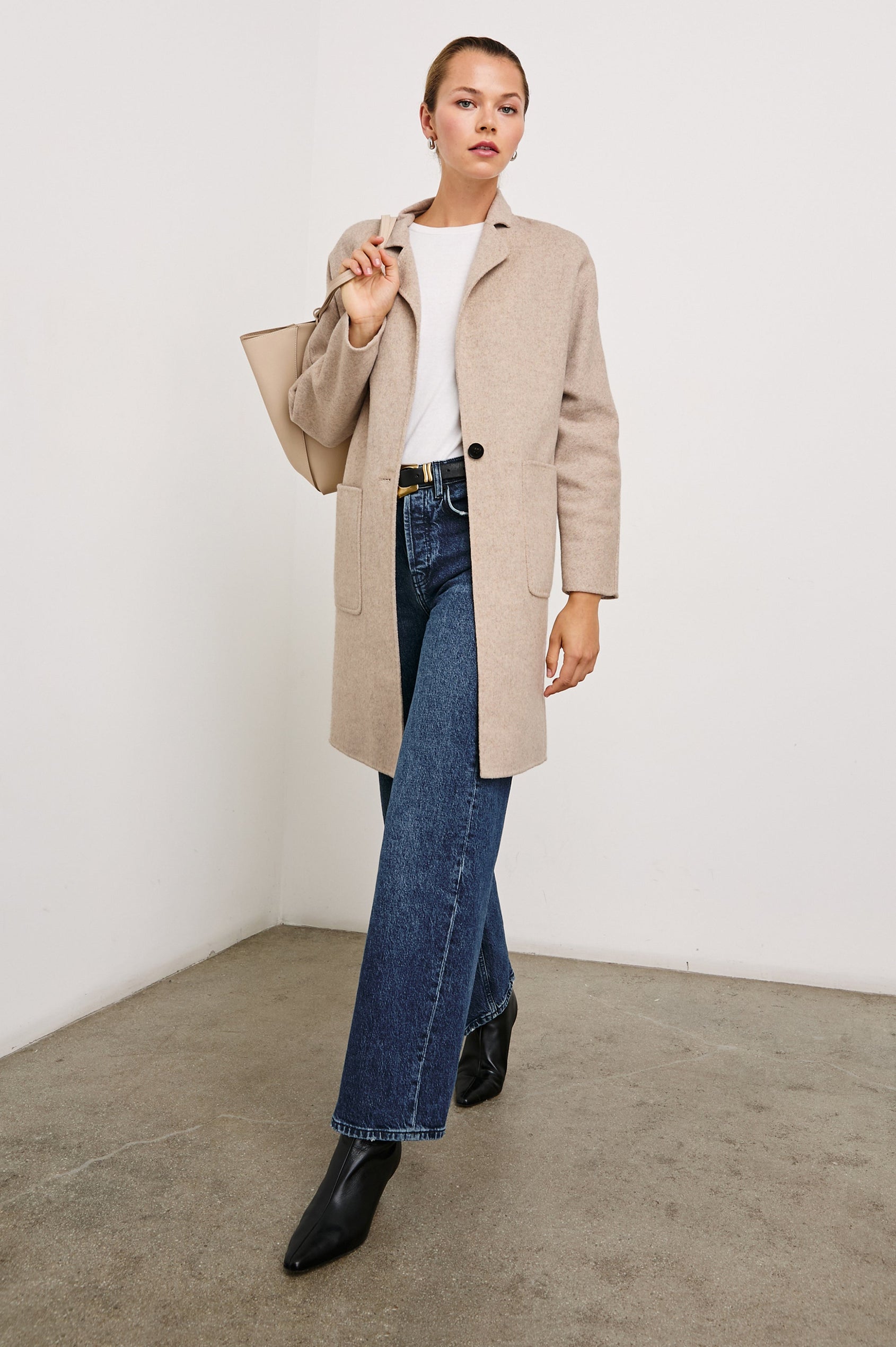 Everest Mid-Thigh Length Coat with Single Button Closure, Notched Lapels and Front Patch Pockets in Oatmeal Colorway - Front Full Body View Featured on Model