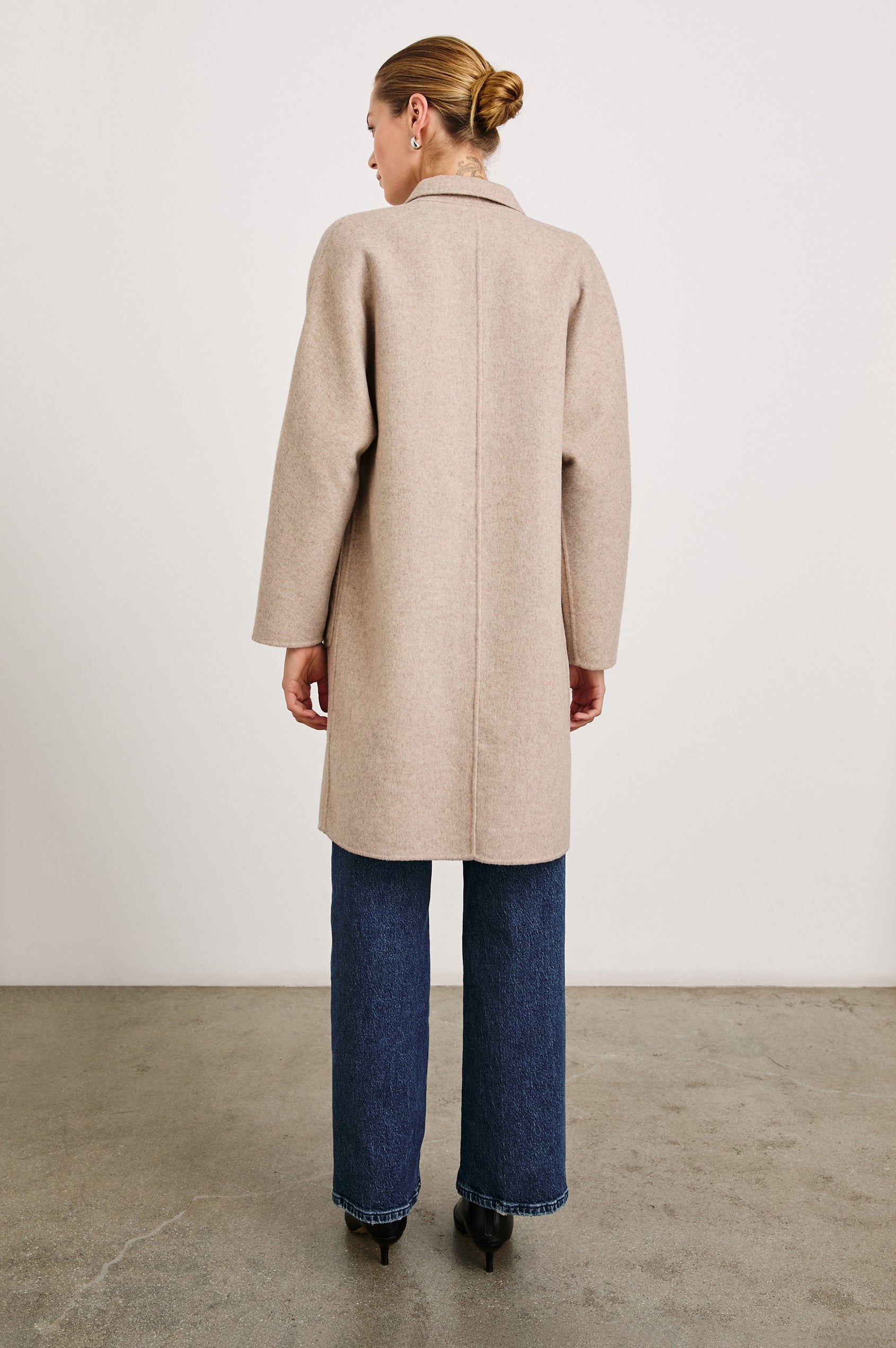 Everest Mid-Thigh Length Coat with Single Button Closure, Notched Lapels and Front Patch Pockets in Oatmeal Colorway - Back Full Body View Featured on Model