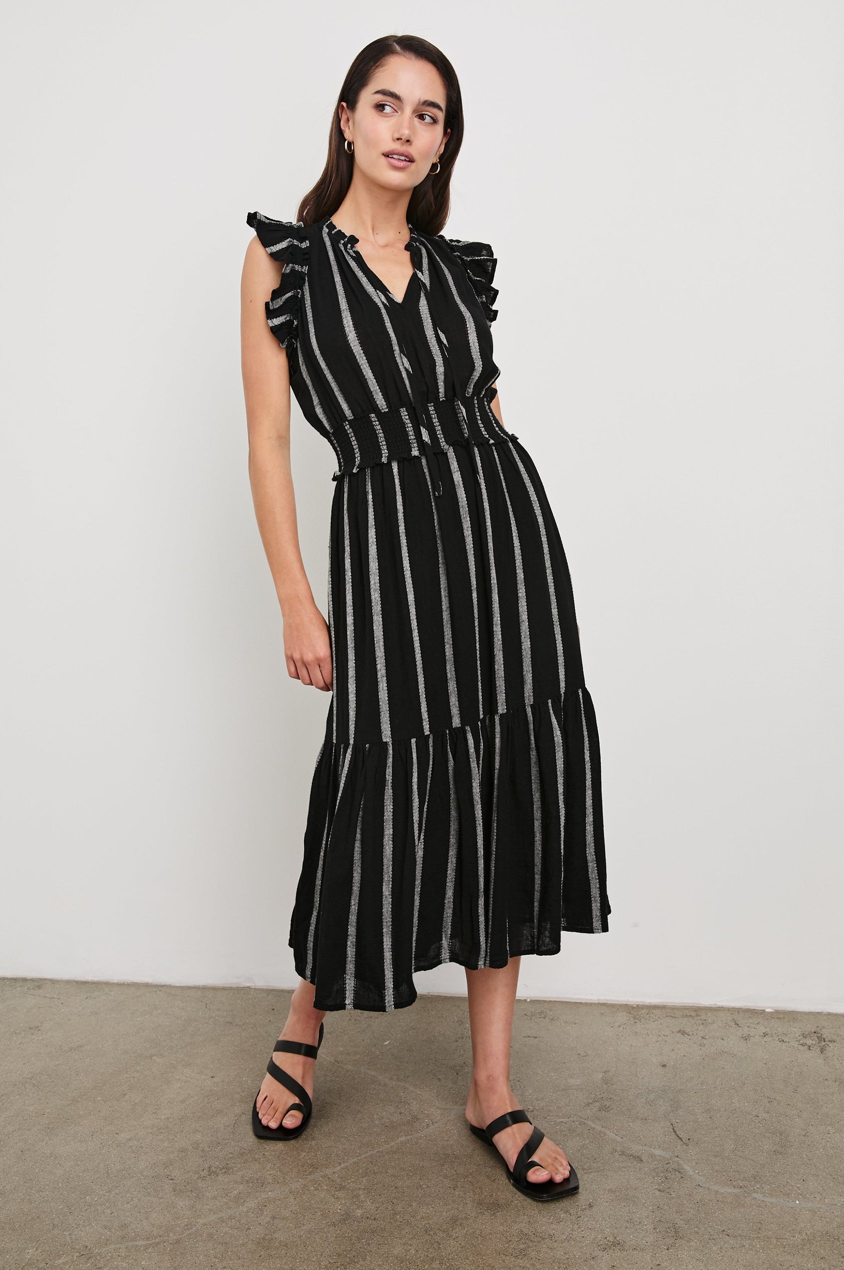 Garden Midi Dress with Flutter Cap Sleeves, Drawstrings at V-Neck and Shirred Waistband in Ash Leno Stripe Colorway, with Grey Vertical Stripes on Black - Front Full Body View Featured on Model