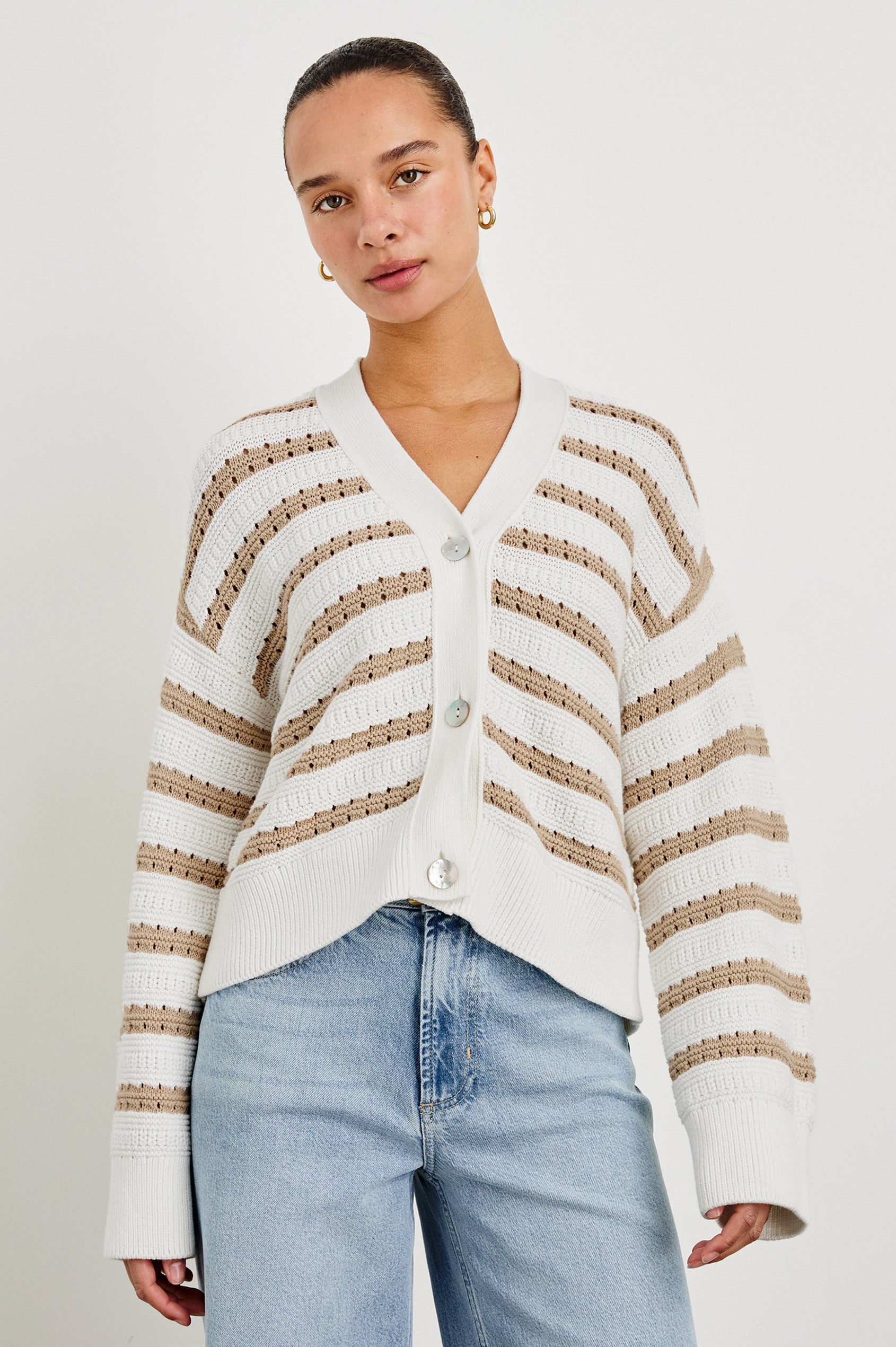 Geneva cropped cardigan sweater with front buttons and contrast trimmings in Ivory Oat Stripe - front view on model
