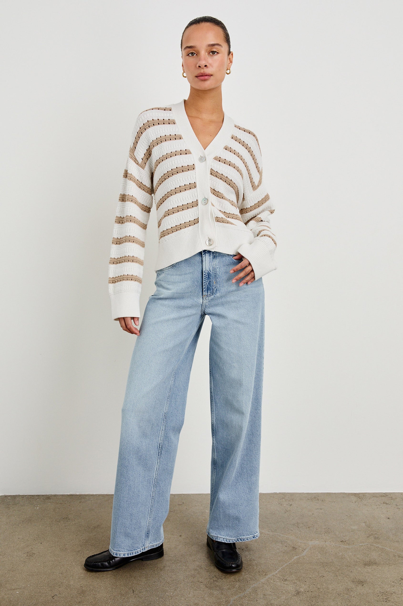 Geneva cropped cardigan sweater with front buttons and contrast trimmings in Ivory Oat Stripe - full body front view on model