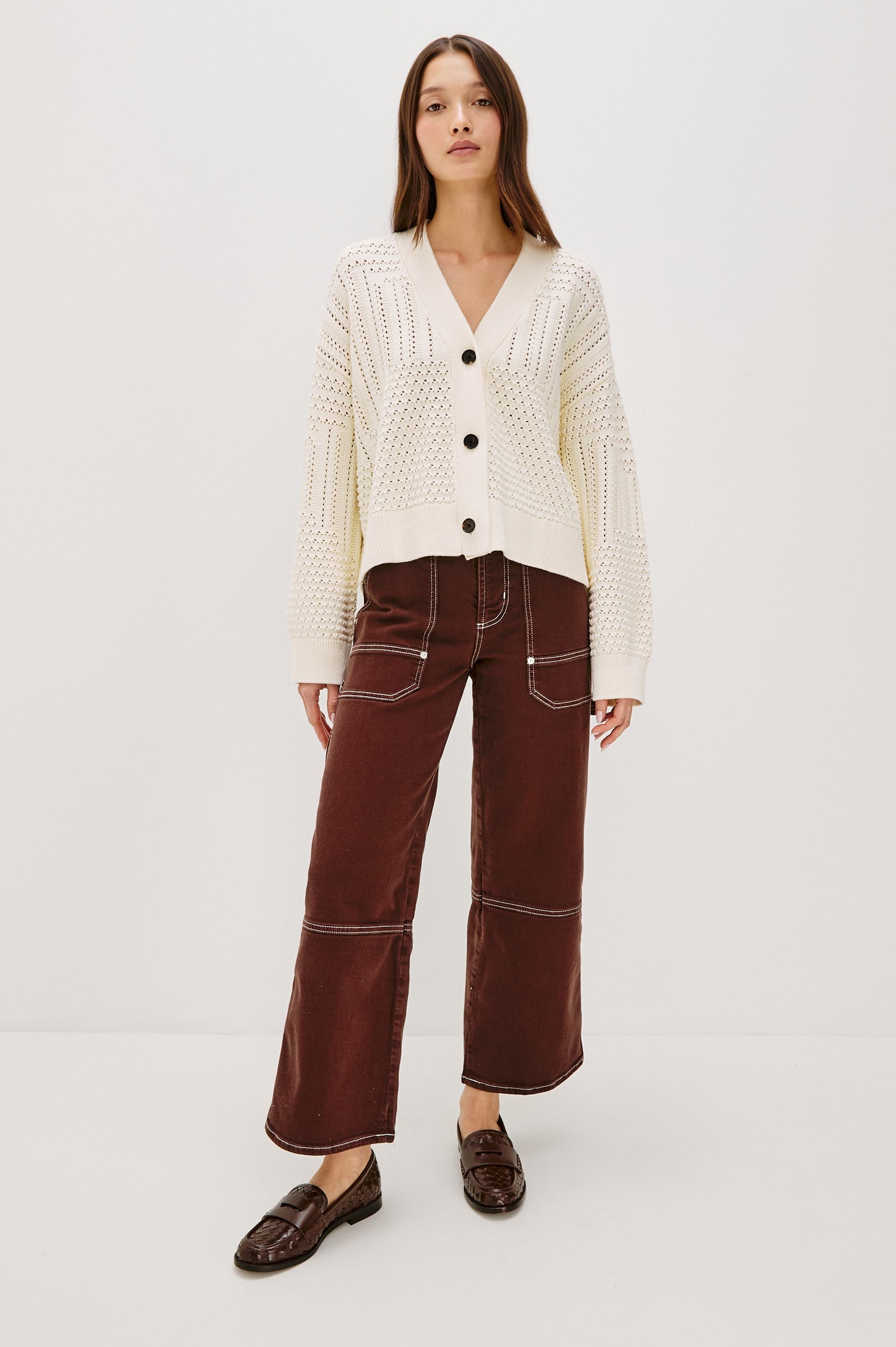 Geneva cropped cardigan sweater with front buttons and pointelle details in Ivory Patchwork Pointelle Colorway - Full Body Front View Featured on Model