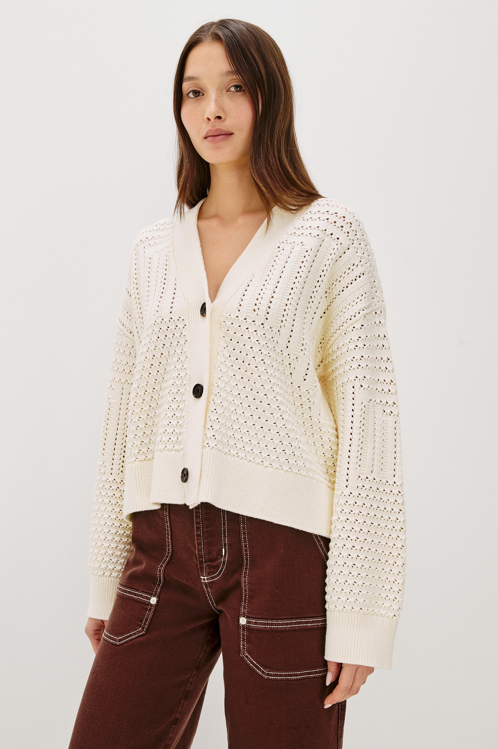 Geneva cropped cardigan sweater with front buttons and pointelle details in Ivory Patchwork Pointelle Colorway - Front View Featured on Model