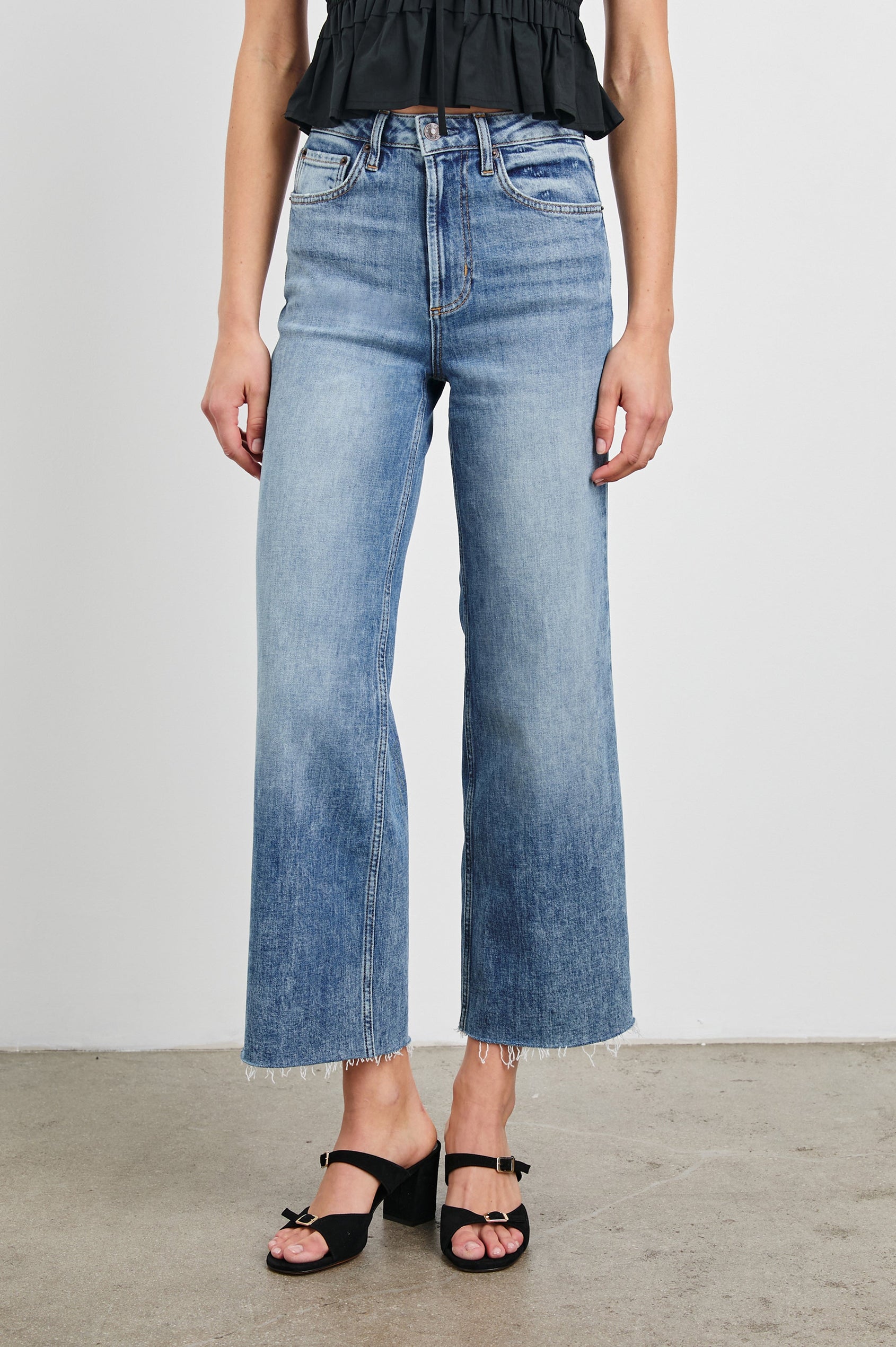 Getty Crop Wide Leg Denim Pants with Belt Loops, Two Front Pockets and Two Back Patch Pockets in Tradewind Colorway - Front View Featured on Model