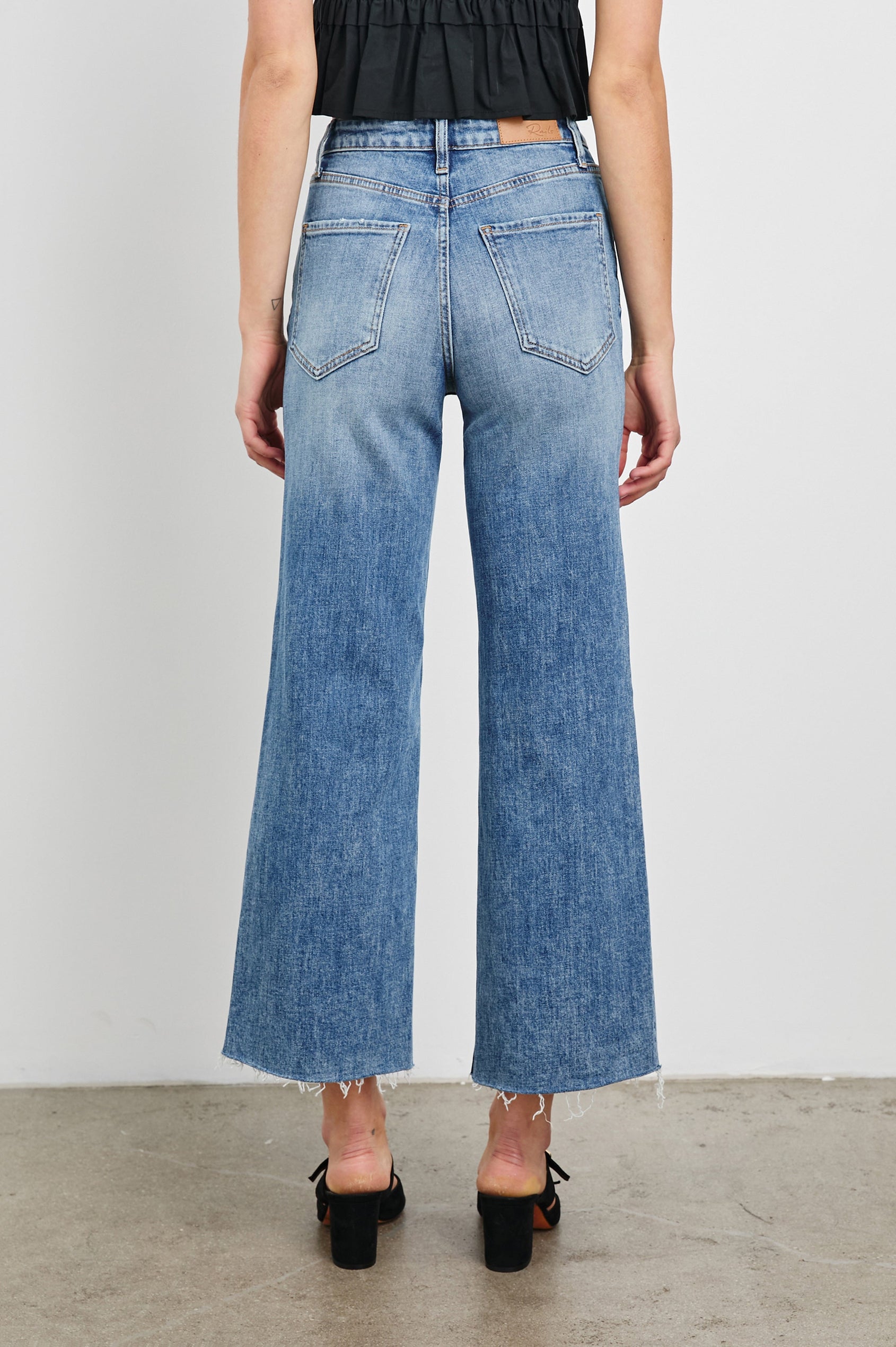 Getty Crop Wide Leg Denim Pants with Belt Loops, Two Front Pockets and Two Back Patch Pockets in Tradewind Colorway - Front View Featured on Model