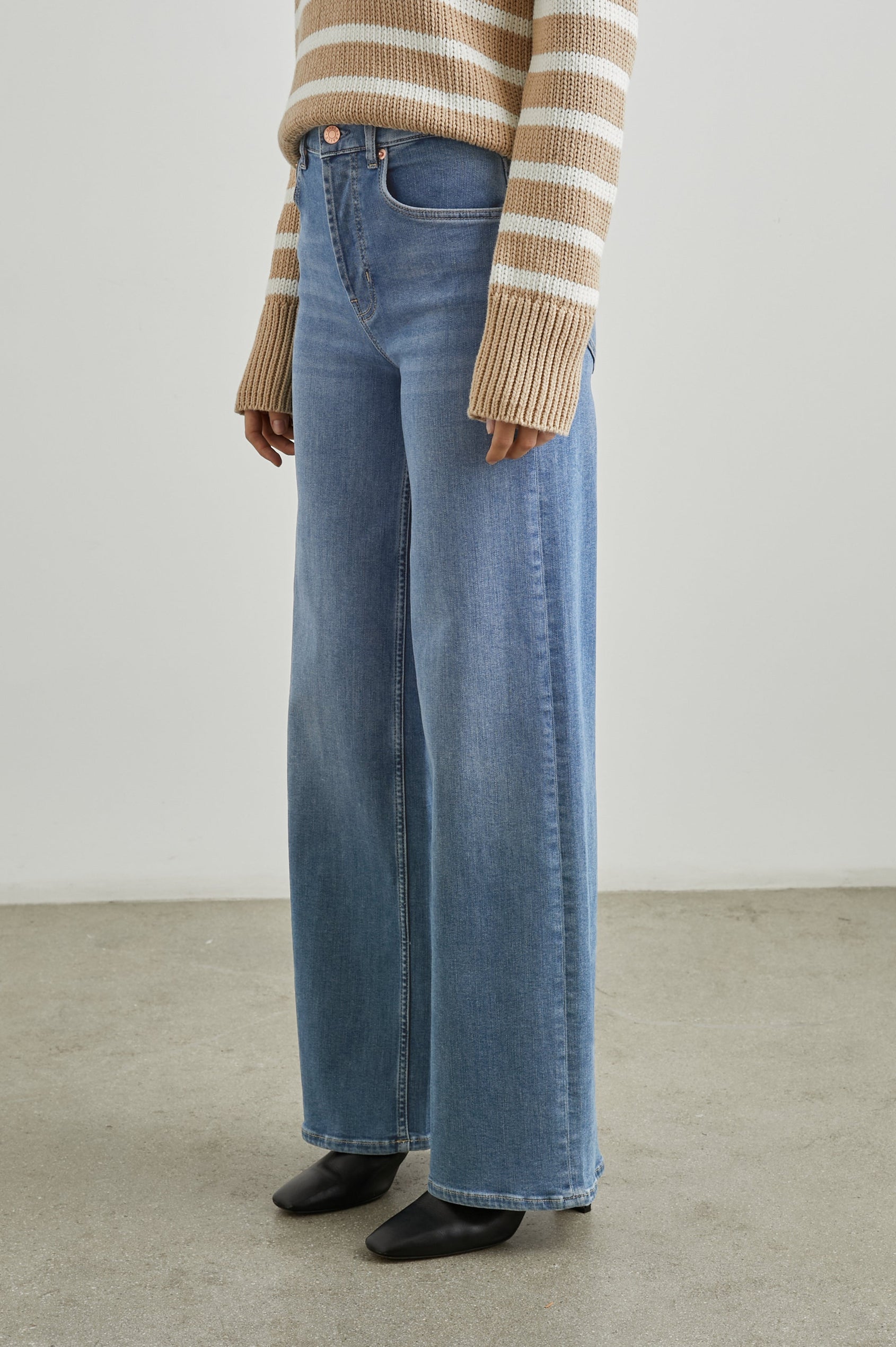 Getty Wide Leg Denim Pants with Belt Loops, Two Front Pockets and Two Back Patch Pockets in East Coast Colorway - Side View Featured on Model