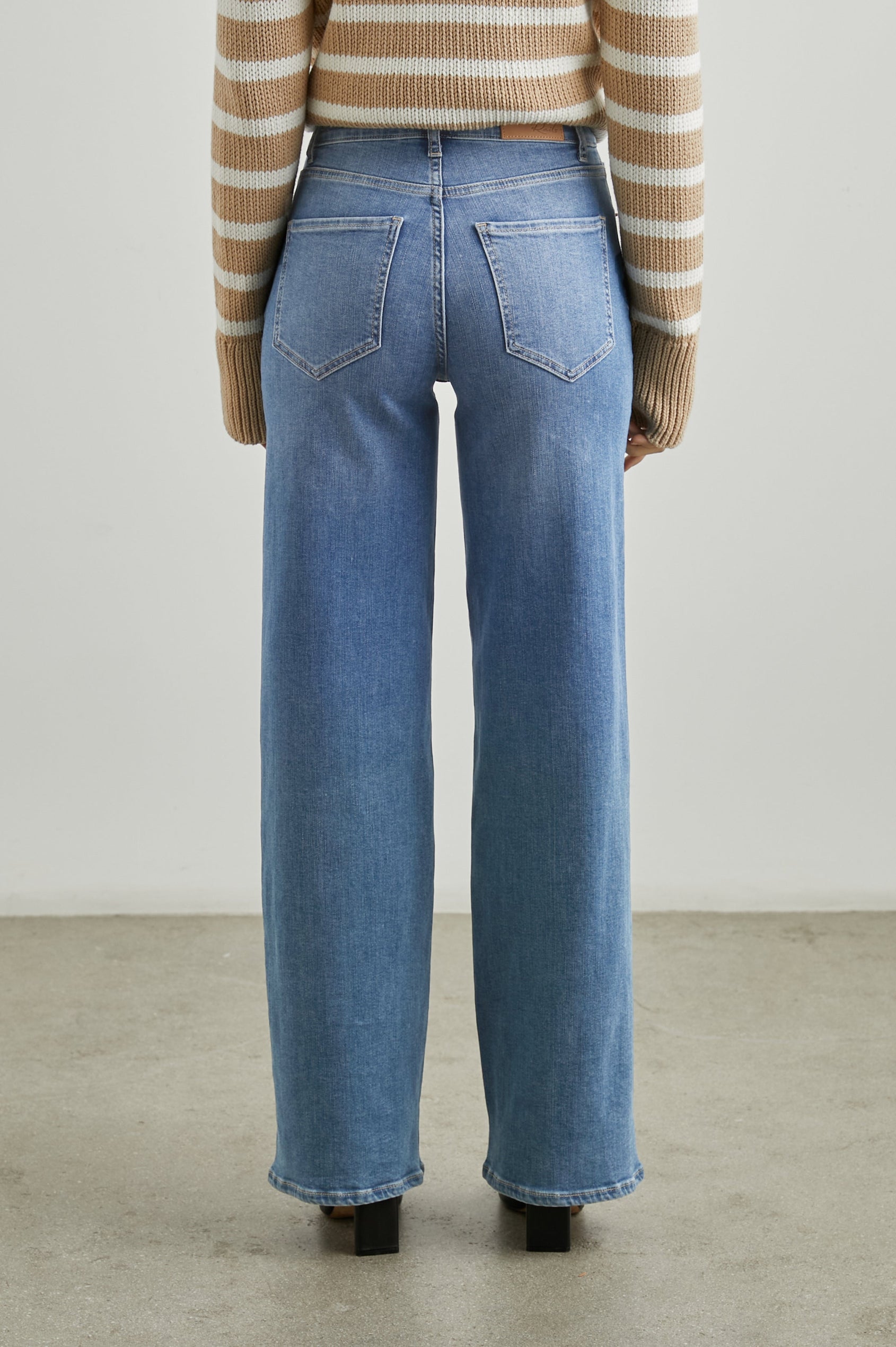 Getty Wide Leg Denim Pants with Belt Loops, Two Front Pockets and Two Back Patch Pockets in East Coast Colorway - Back View Featured on Model