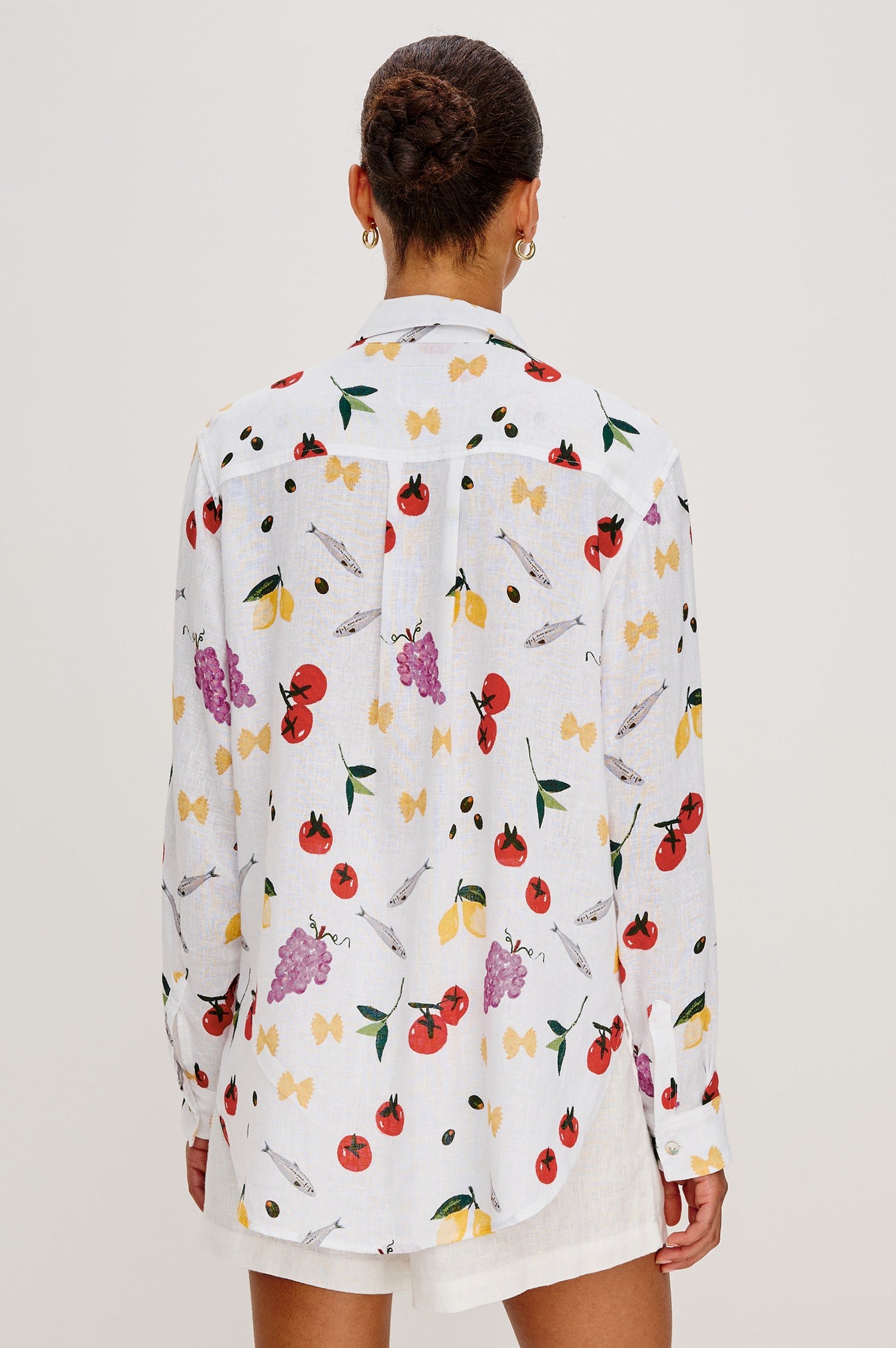 Giada lightweight linen button up shirt in Dinner Party colorway featuring Italian inspired sketches - back view on model