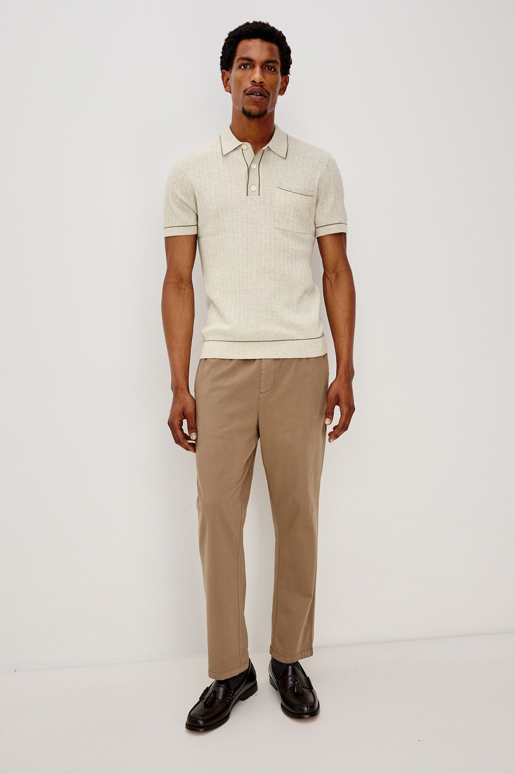 Hardy short sleeve cotton rib polo with chest pocket, two button placket and contrast stitching in Oat Heather - full body front view on model