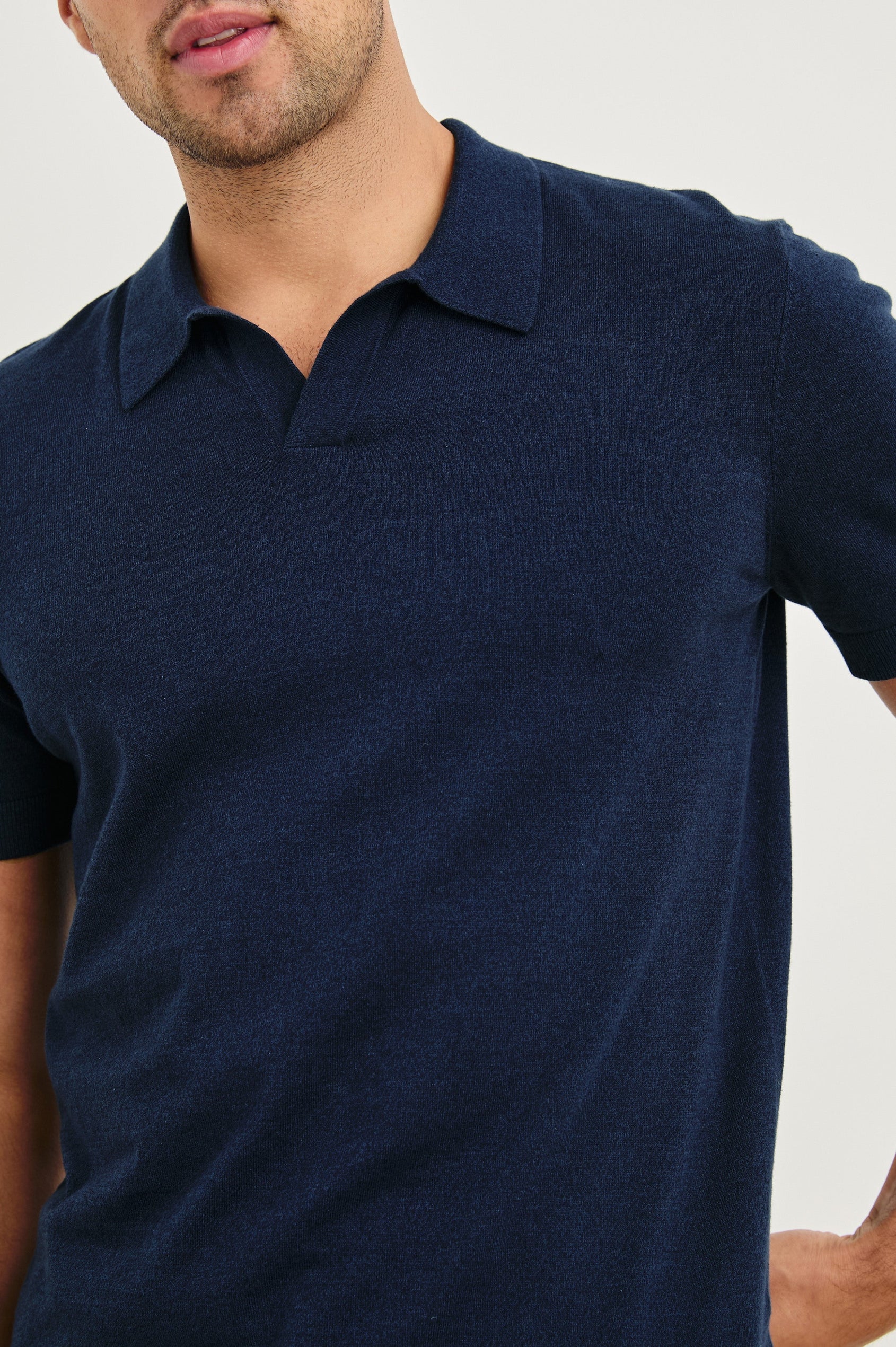 Hayden cotton short sleeve polo with collar and short placket in Navy - close up of details on model
