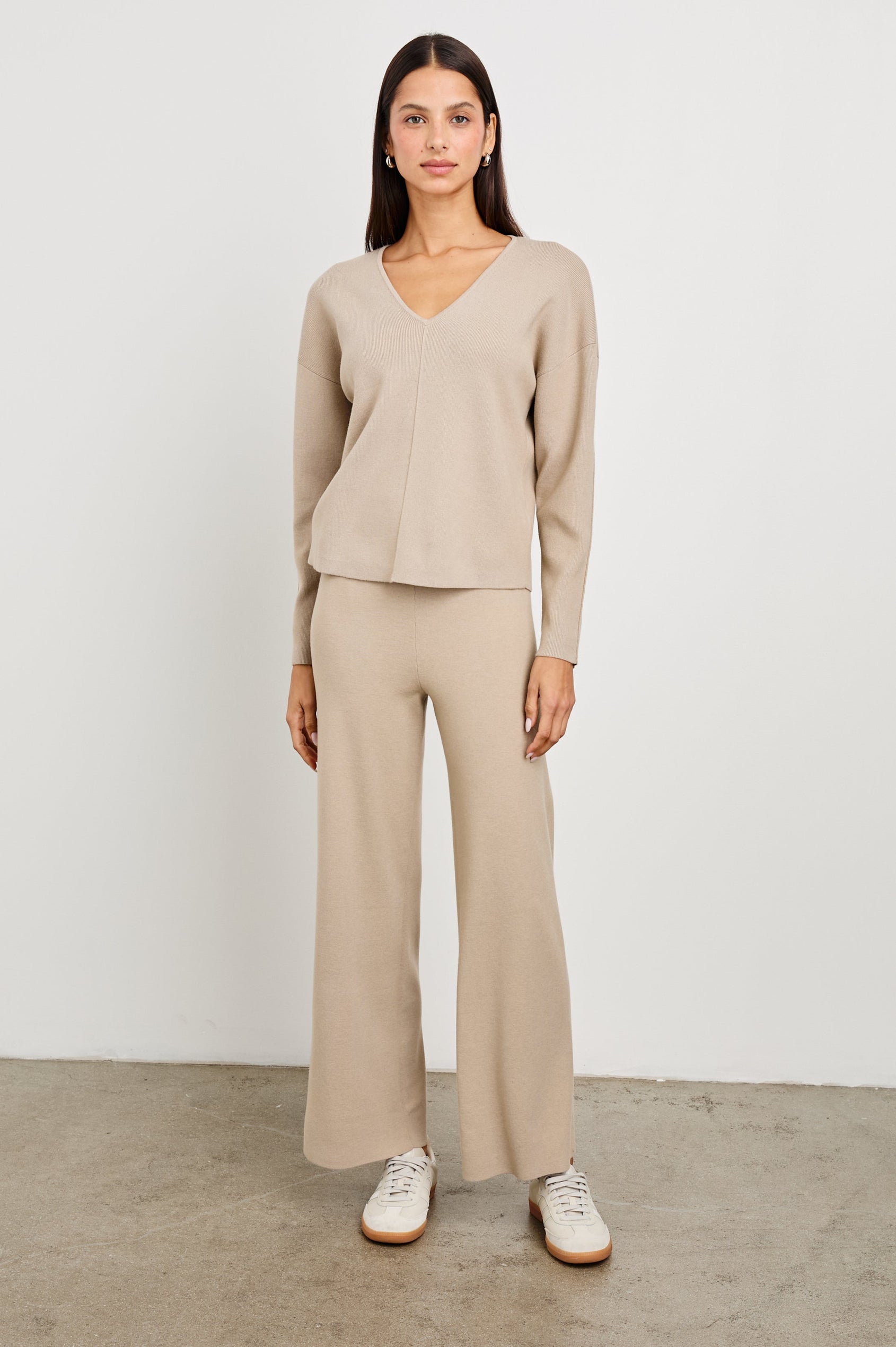 Hollyn Long-Sleeve, V Neck Sweater with a Vertical Seam Down the Front Bodice in Oatmeal Colorway - Front Full Body View Featured on Model