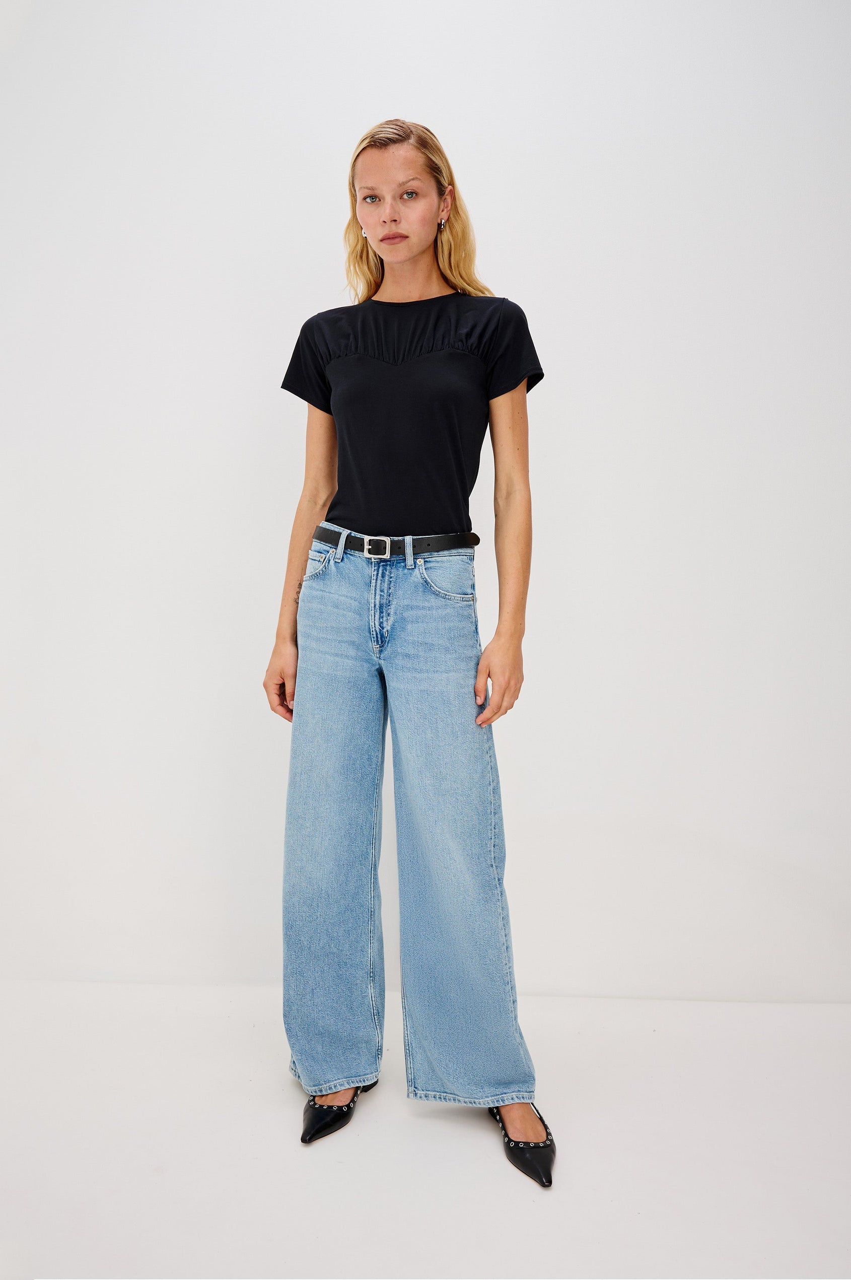 Janis crewneck short sleeve t-shirt with sweetheart neckline hem details in Black colorway - full body front view on model