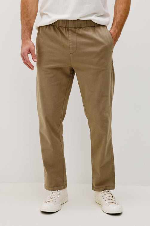 Julian Pants with an Elastic Waist, Two Front Pockets and Two Back Welt Pockets in Barley Colorway - Front View Featured on Model