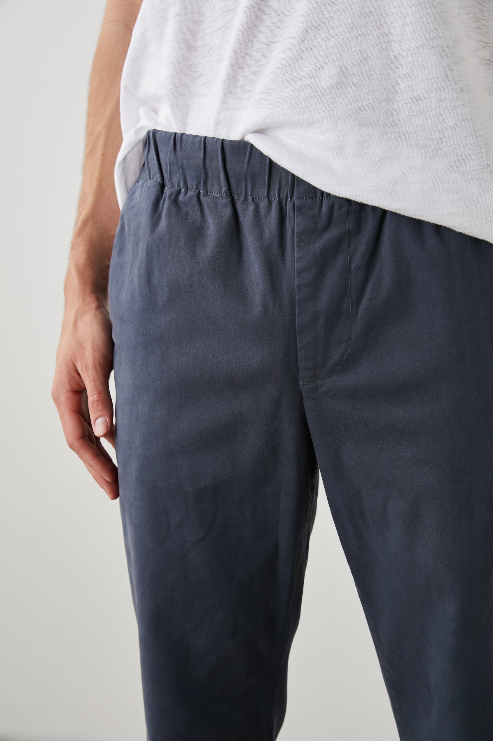 Julian Pants with an Elastic Waist, Two Front Pockets and Two Back Welt Pockets in Faded Blue Colorway - Front View Featured on Model