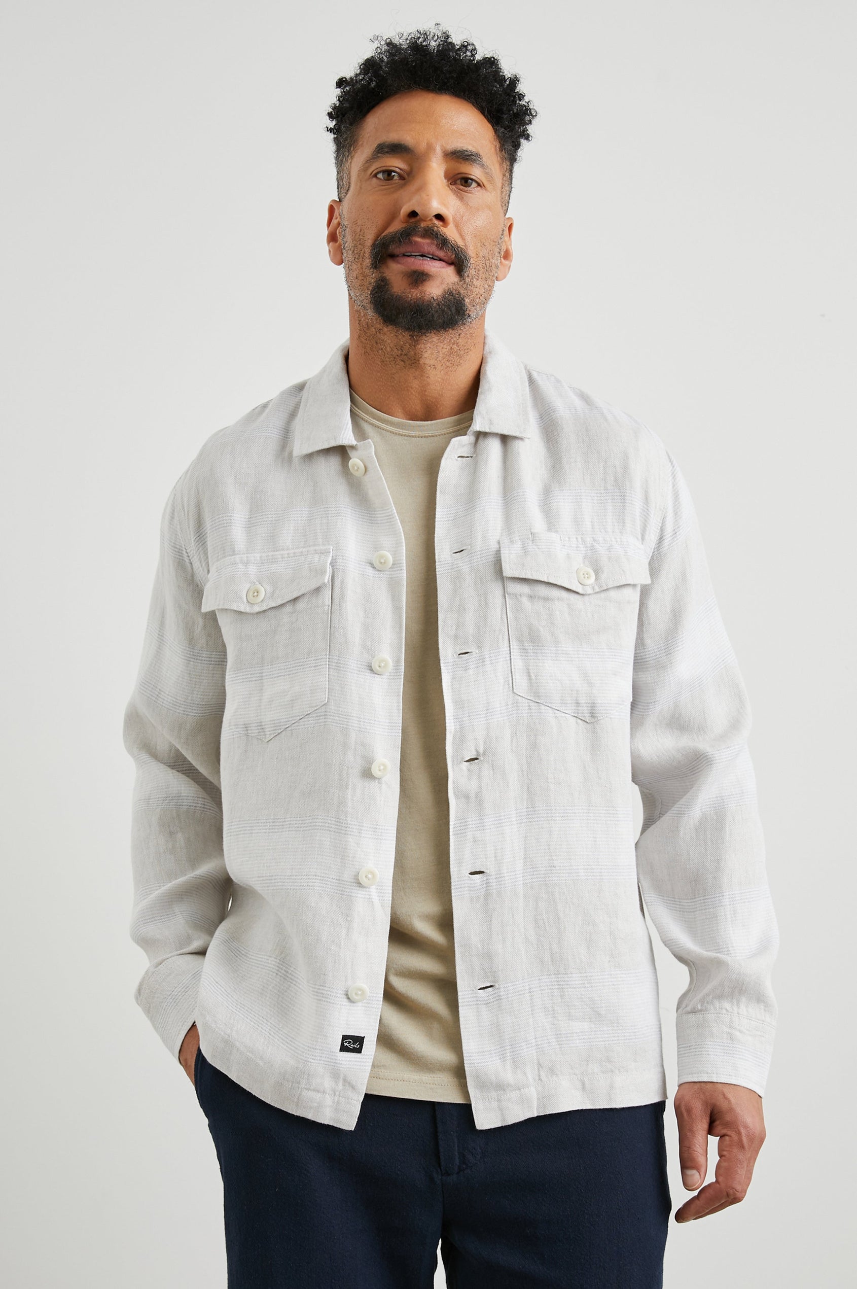 Kerouac Long-Sleeve Shirt Jacket with Button Closure and Two Button Chest Flap Pockets in Wicker Graphite Stripe Colorway, Grey and White Horizontal Stripes on Wicker - Front Unbuttoned View Featured on Model