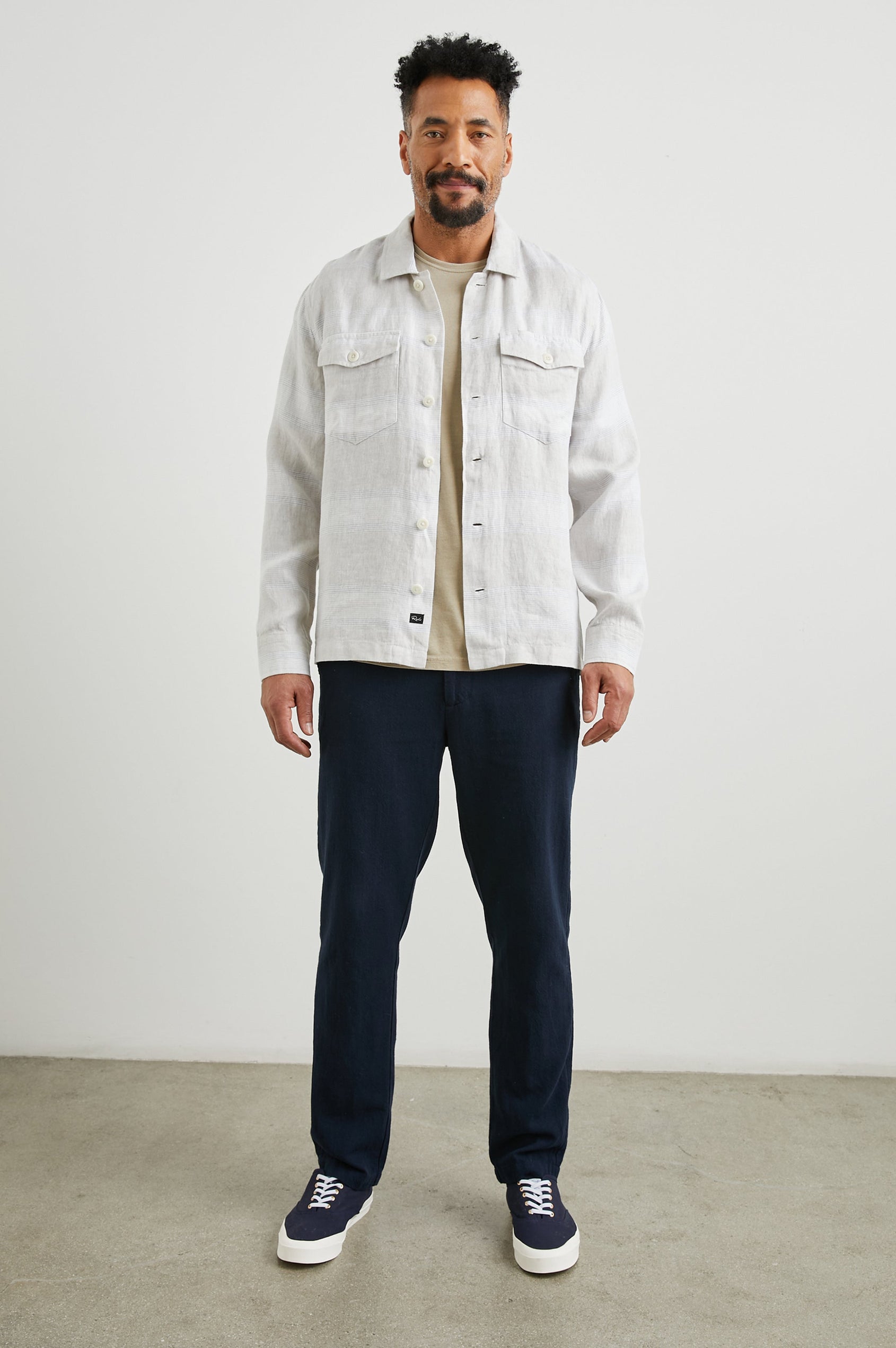 Kerouac Long-Sleeve Shirt Jacket with Button Closure and Two Button Chest Flap Pockets in Wicker Graphite Stripe Colorway, Grey and White Horizontal Stripes on Wicker - Front Unbuttoned Full Body View Featured on Model