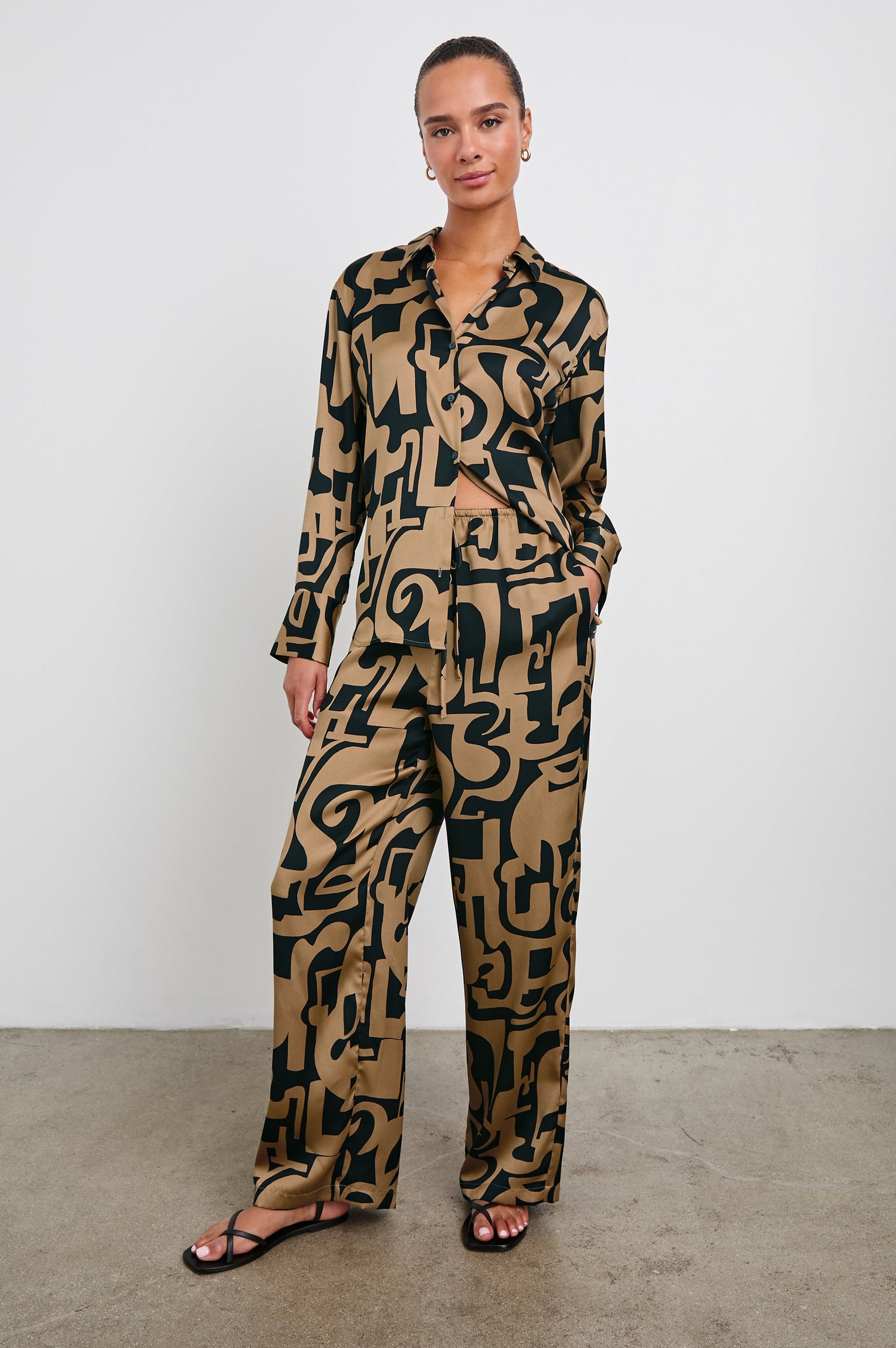 Ledger Long-Sleeve Button Down in Santorini Sand Colorway, a black and sand-colored design - Front Full Body View Featured on Model