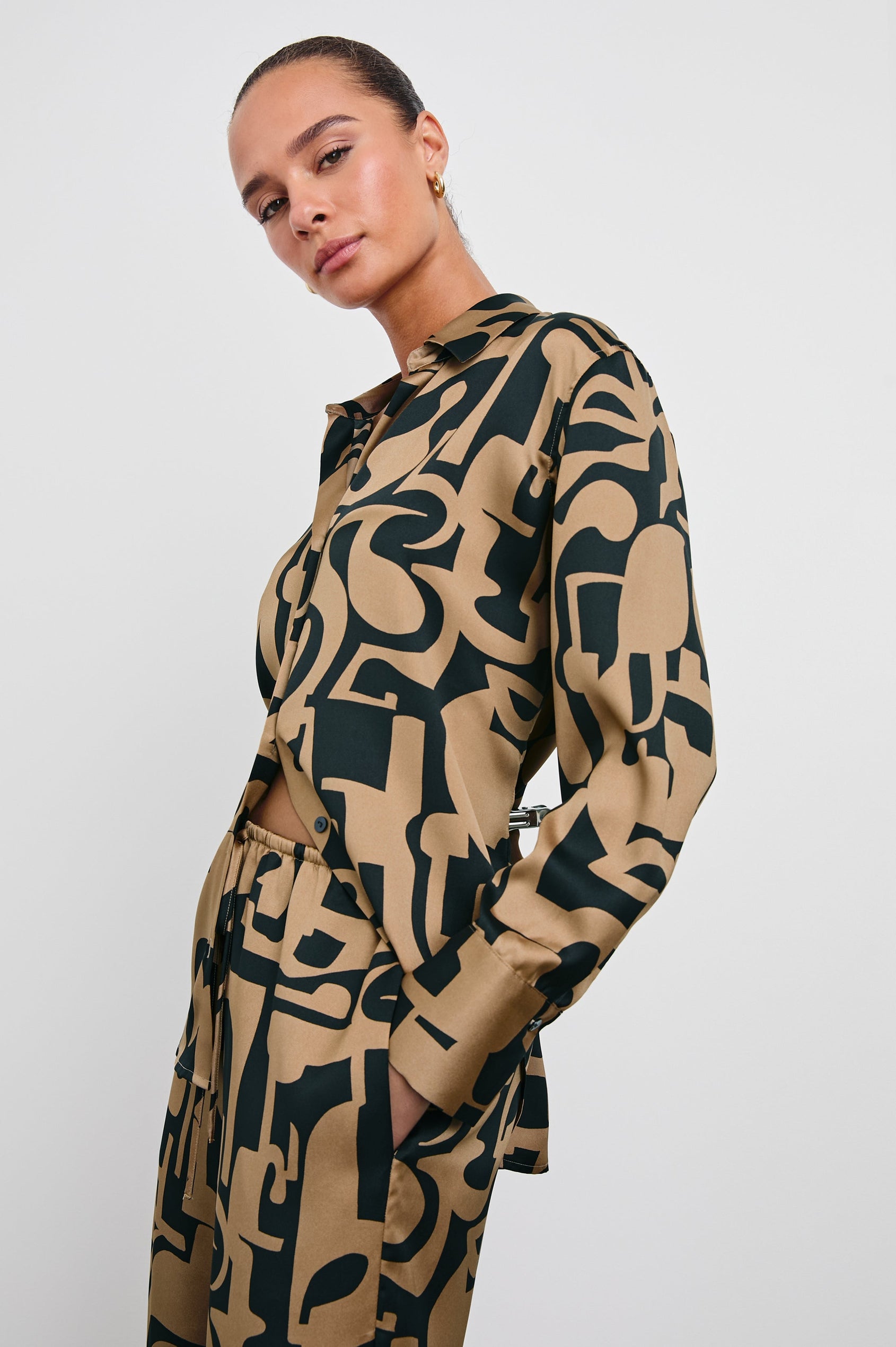 Ledger Long-Sleeve Button Down in Santorini Sand Colorway, a black and sand-colored design - Front View Featured on Model