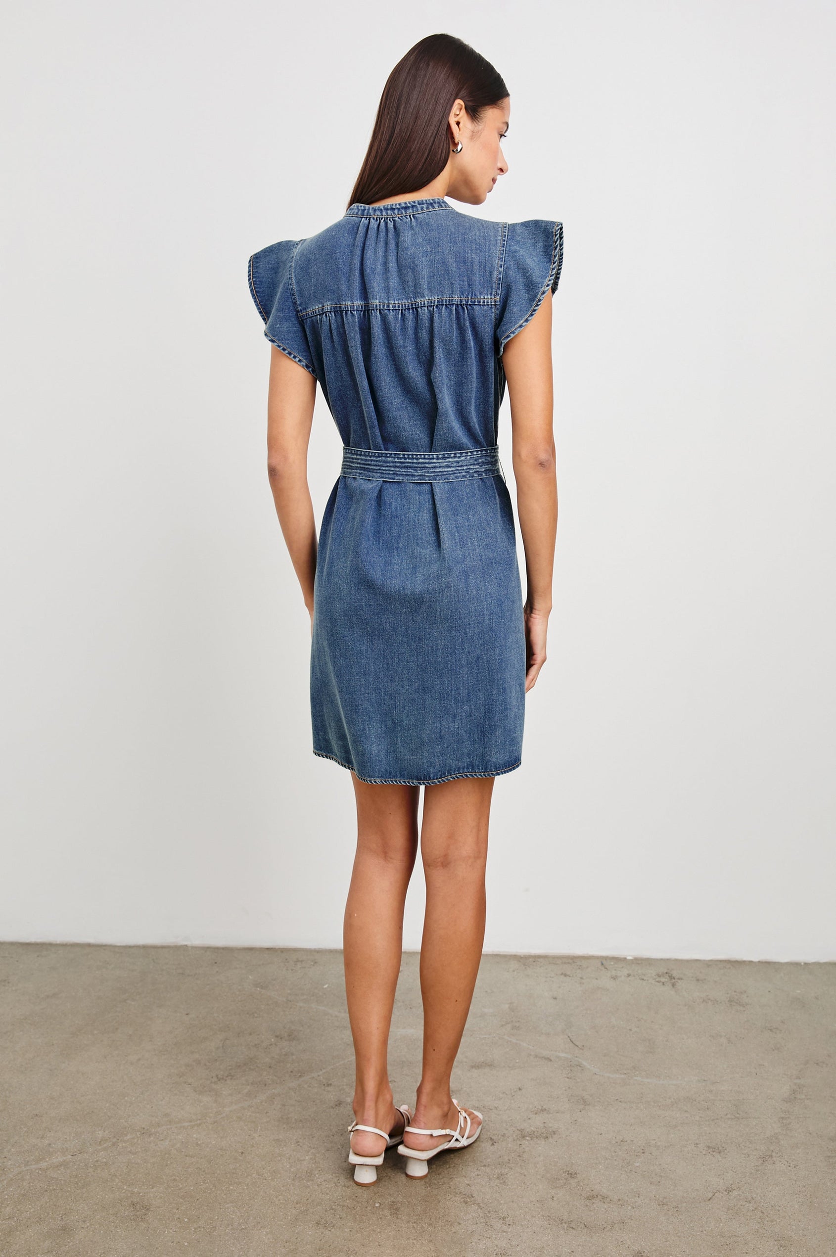 Letta Above-Knee Dress with Flutter Sleeves, Snaps down the Front, and a Belted Waist in Classic Blue Colorway - Back Full Body View Featured on Model
