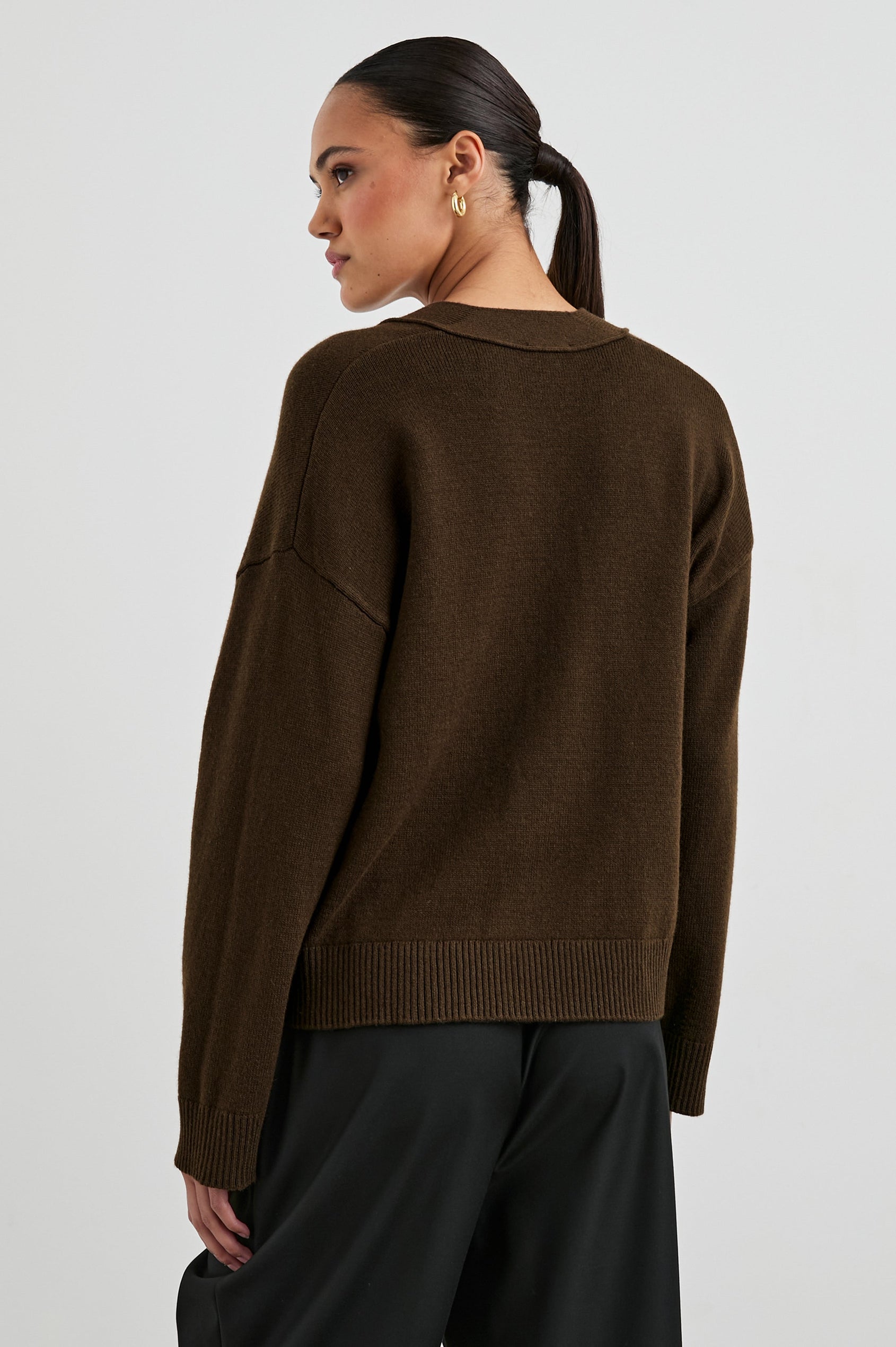 Lindi Long-Sleeve V Neck Cardigan with Three Button Closure, Two Front Patch Pockets and Ribbed Trim in Dark Moss Colorway - Back View Featured on Model