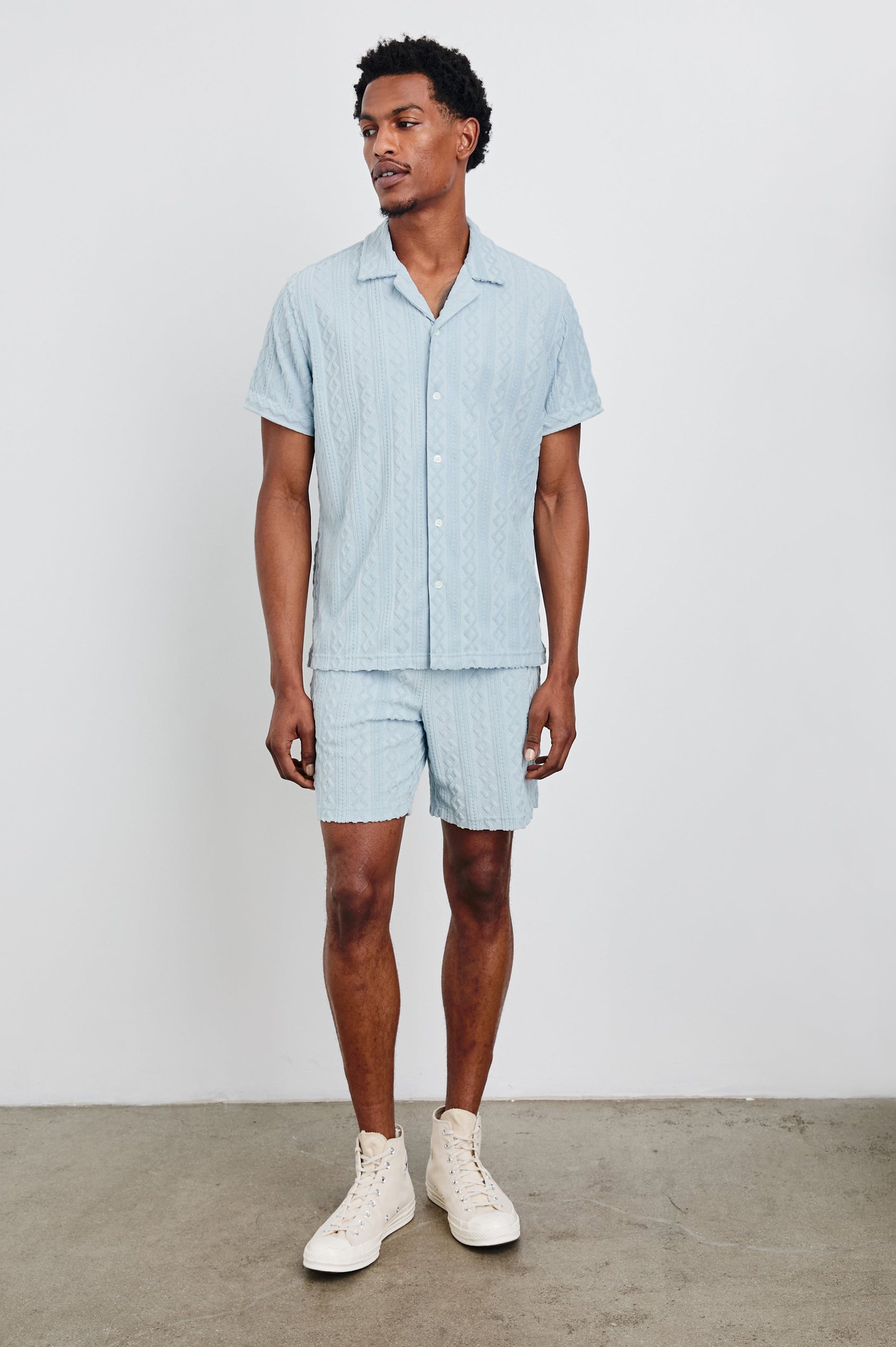 Maverick Short Sleeve Button Up with a raised jacquard pattern in Coastal Blue Colorway - Front Full Body View Featured on Model