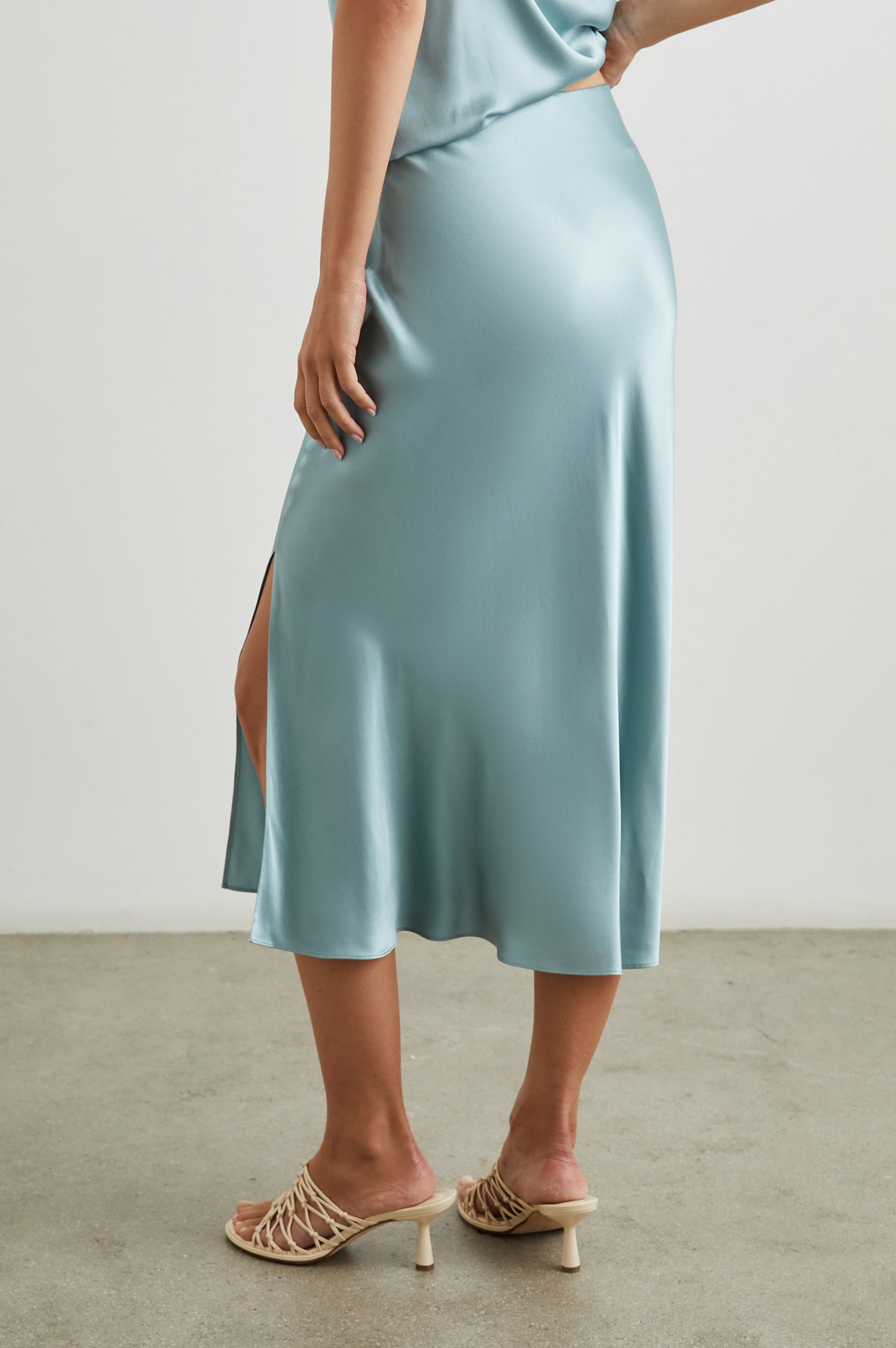 Maya Midi Skirt with Mid-Thigh Side Slit in Clearwater Colorway - Back View Featured on Model