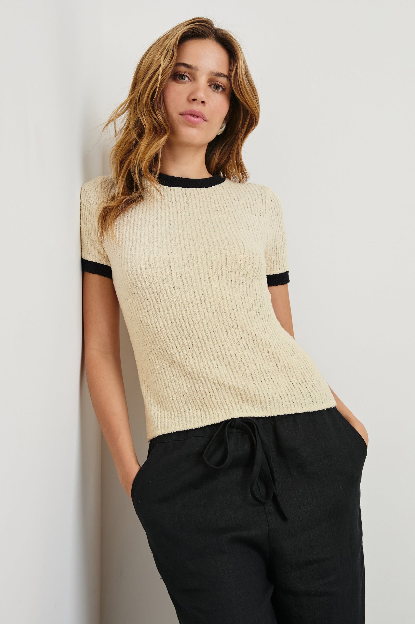 Meredith Short-Sleeve Ribbed Top with Crew Neckline in Ivory Black Colorway, with Black trim at the Neckline and Cuffs - Front View Featured on Model