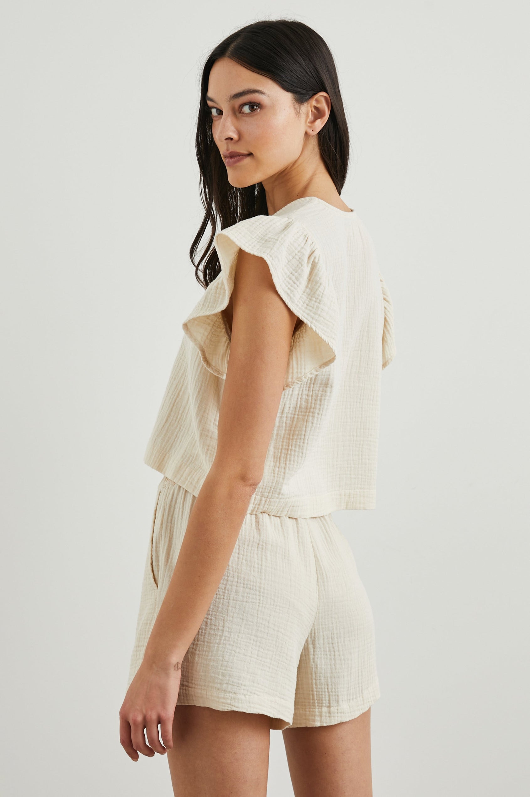 Miley Cropped, Short-Sleeve, V Neck Top with Flutter Sleeves and Textured Fabric in Flex Colorway - Side View Featured on Model