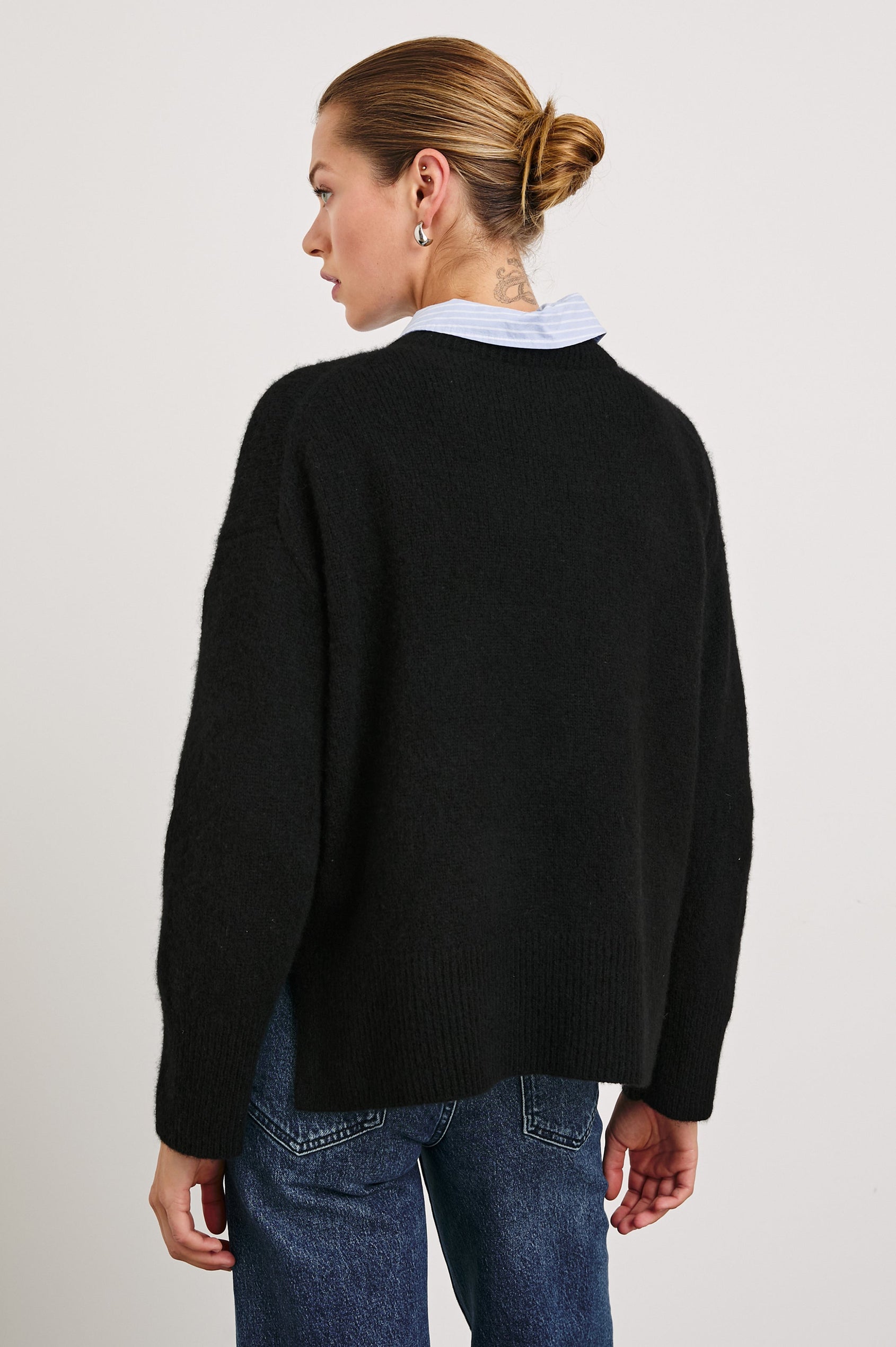 Miranda Long-Sleeve Sweater with a Mock Neck, Side Slits, and Ribbed Trim in Oatmeal Colorway - Back View Featured on Model
