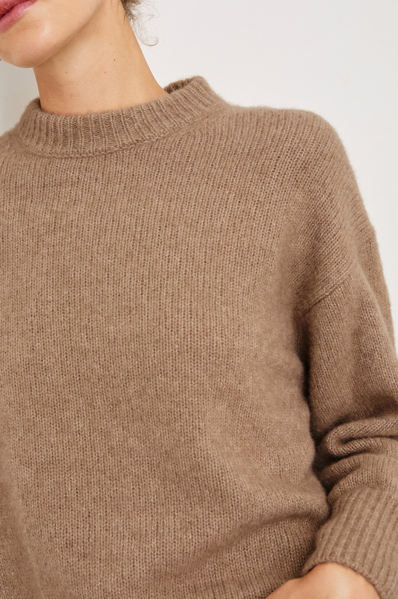 Miranda Long-Sleeve Sweater with a Mock Neck, Side Slits, and Ribbed Trim in Oatmeal Colorway - Front View Featured on Model