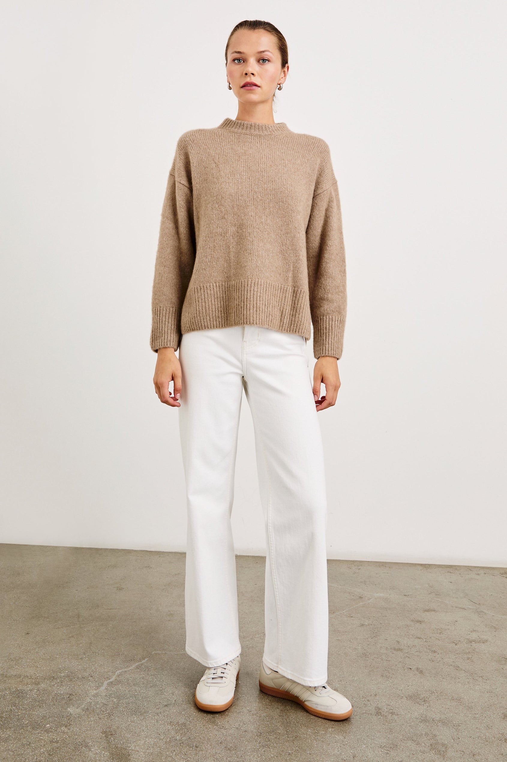 Miranda Long-Sleeve Sweater with a Mock Neck, Side Slits, and Ribbed Trim in Oatmeal Colorway - Front Full Body View Featured on Model